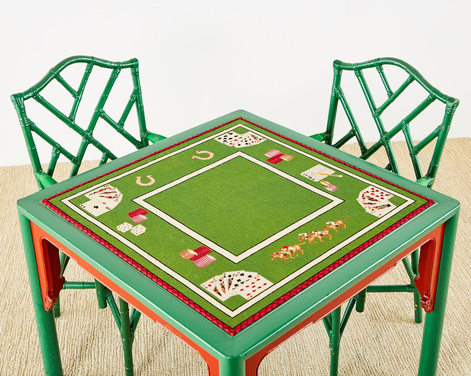 Maximalist Mid-Century Modern poker games table featuring a Trompe l'oeil needlepoint top depicting playing cards, racehorses, chips, horseshoes, and dice. The square table has a lucky green lacquered finish with Asian Style red spandrels adding to