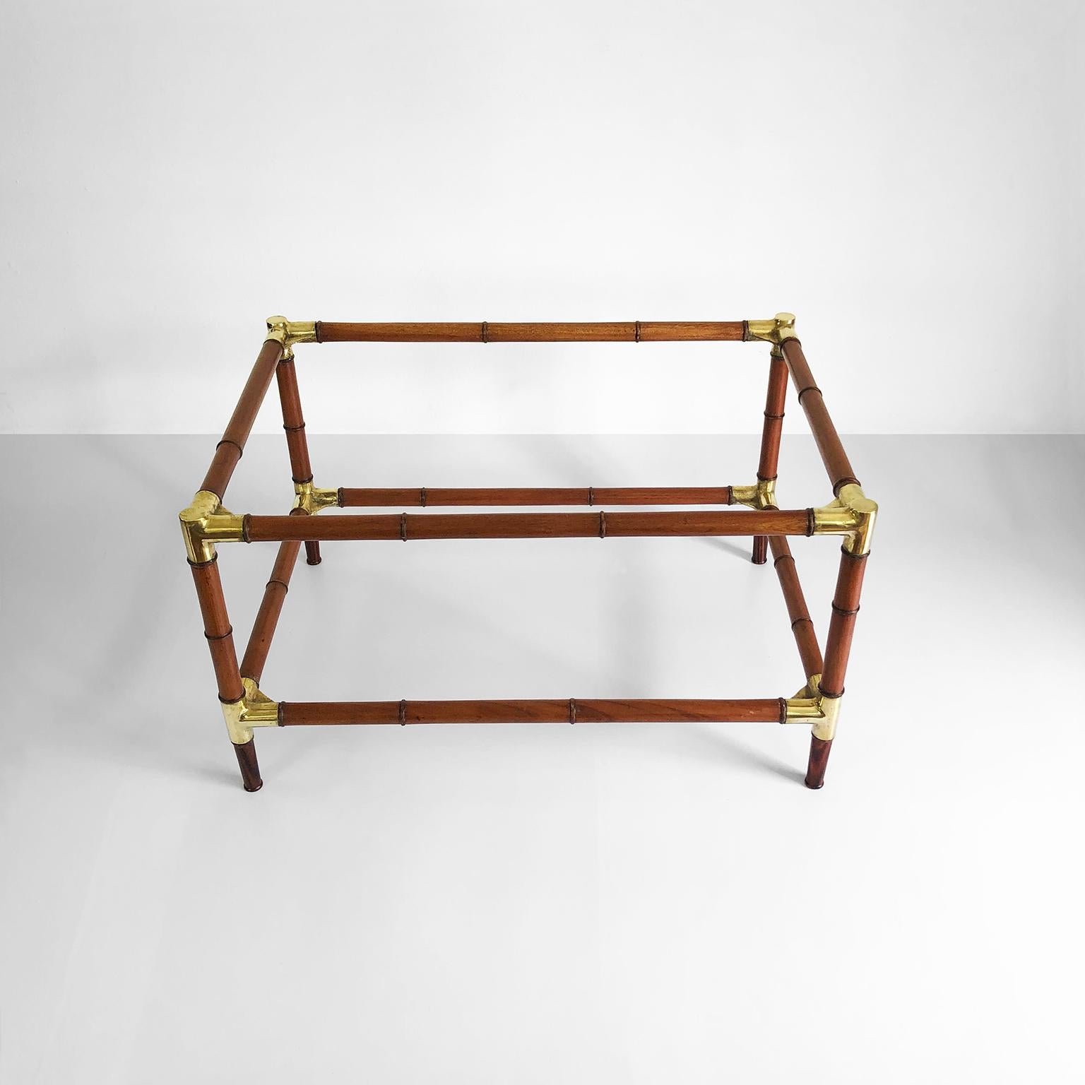Circa 1960, we offer this, midcentury bamboo and brass Mexican coffee table with two crystal shelves, made in two precious kind of woods mahogany and cocobolo.

Note: The table not include glass cover for better shipping.