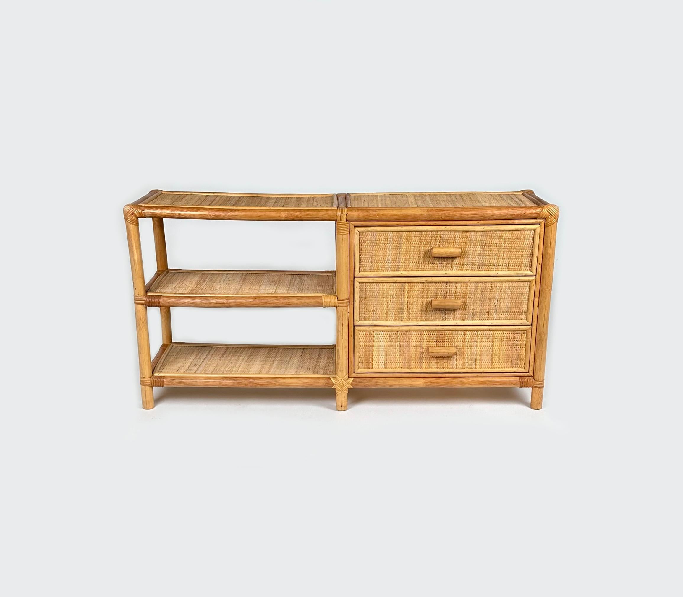 Rectangular sideboard in bamboo and rattan composed of three drawers with handles and three shelves. 

Made in Italy in the 1970s.
