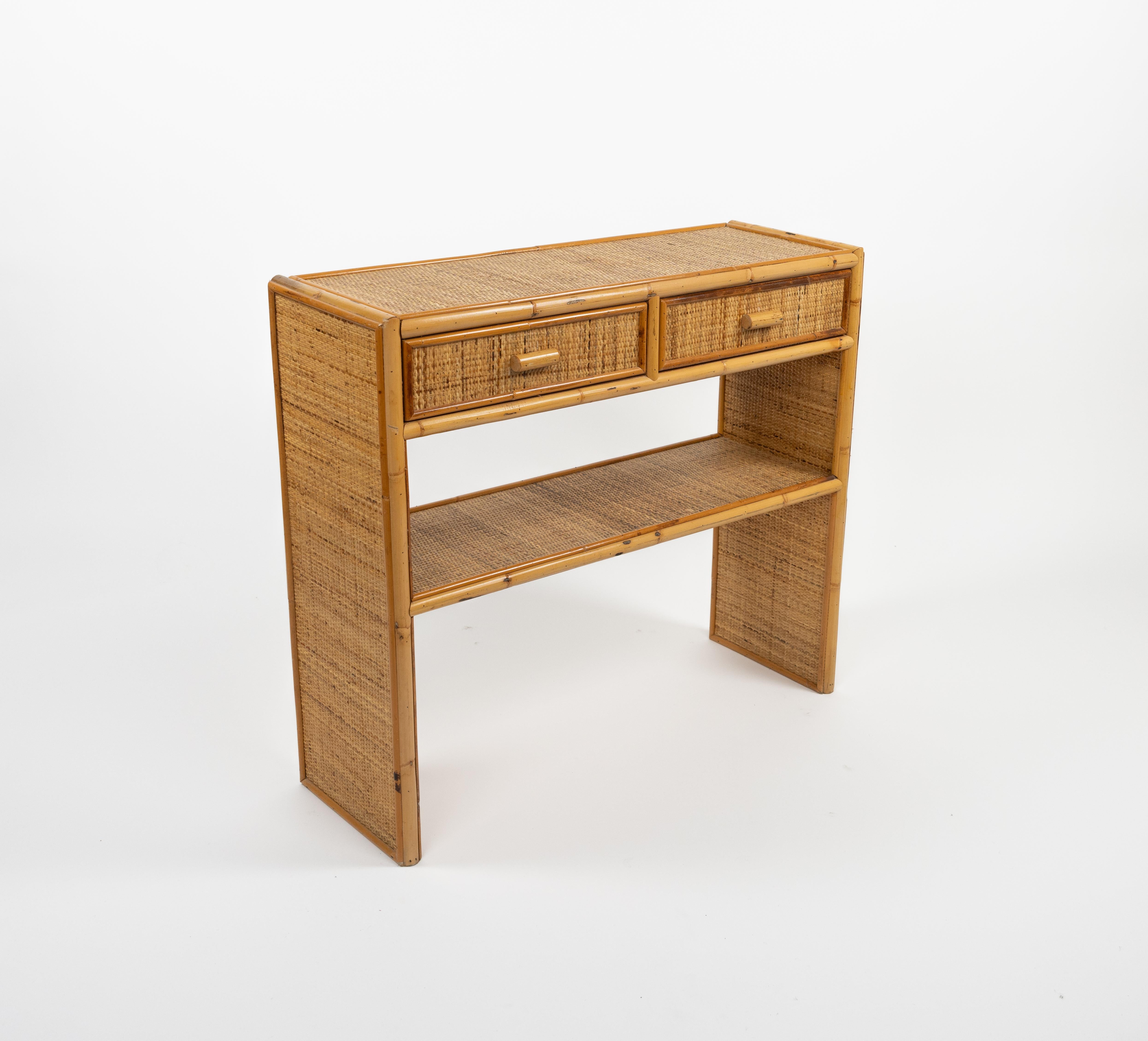 Midcentury beautiful console table in bamboo and rattan with 2 drawers in the style of Dal Vera.

Made in Italy in the 1970s.