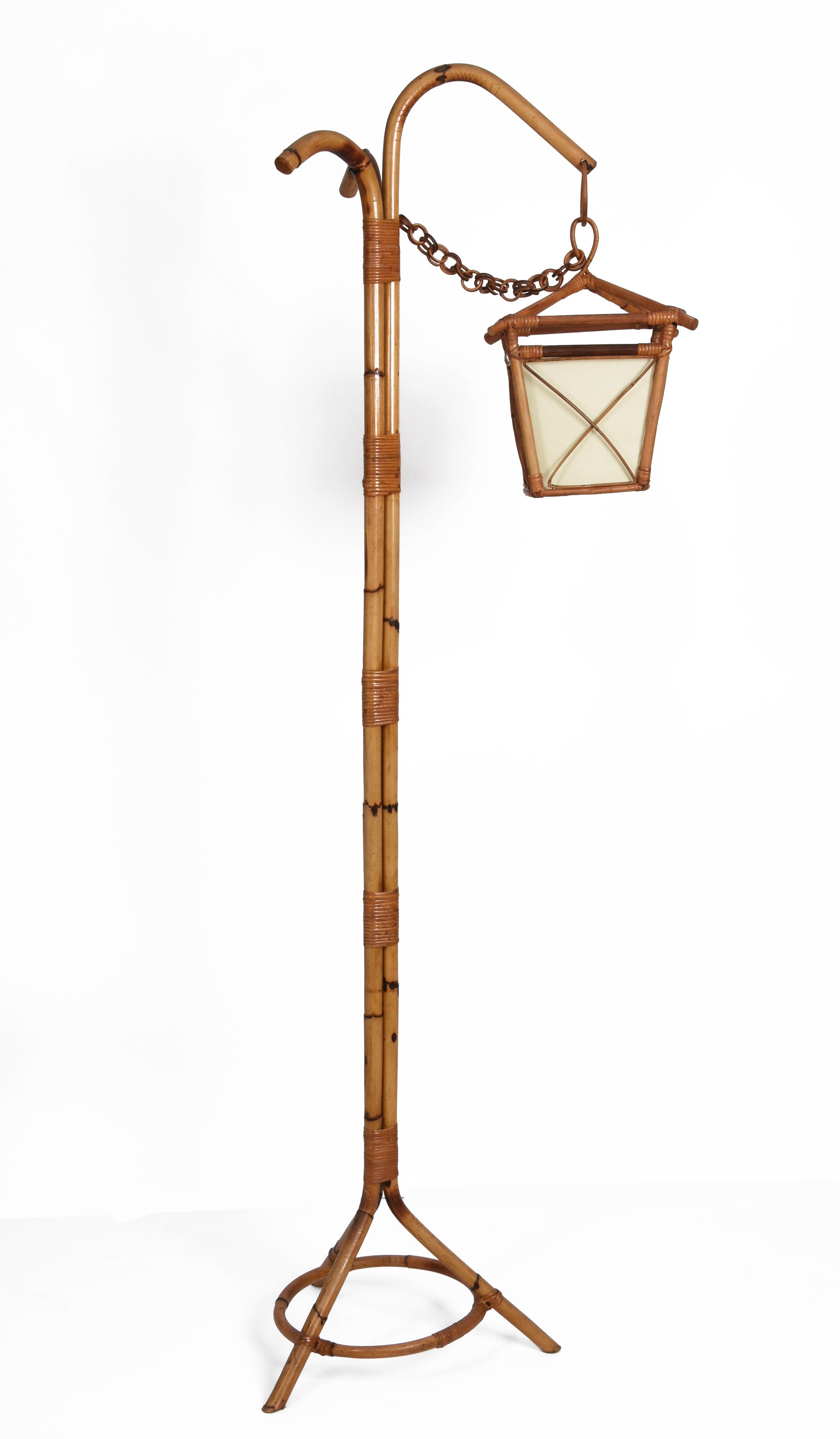 Amazing Mid-Century Modern bamboo and rattan floor lamp. This fantastic item was produced in Italy during the1950s.

This astonishing piece is made in Louis Sognot's style. The parchment paper lampshade covering the light is just amazing and will