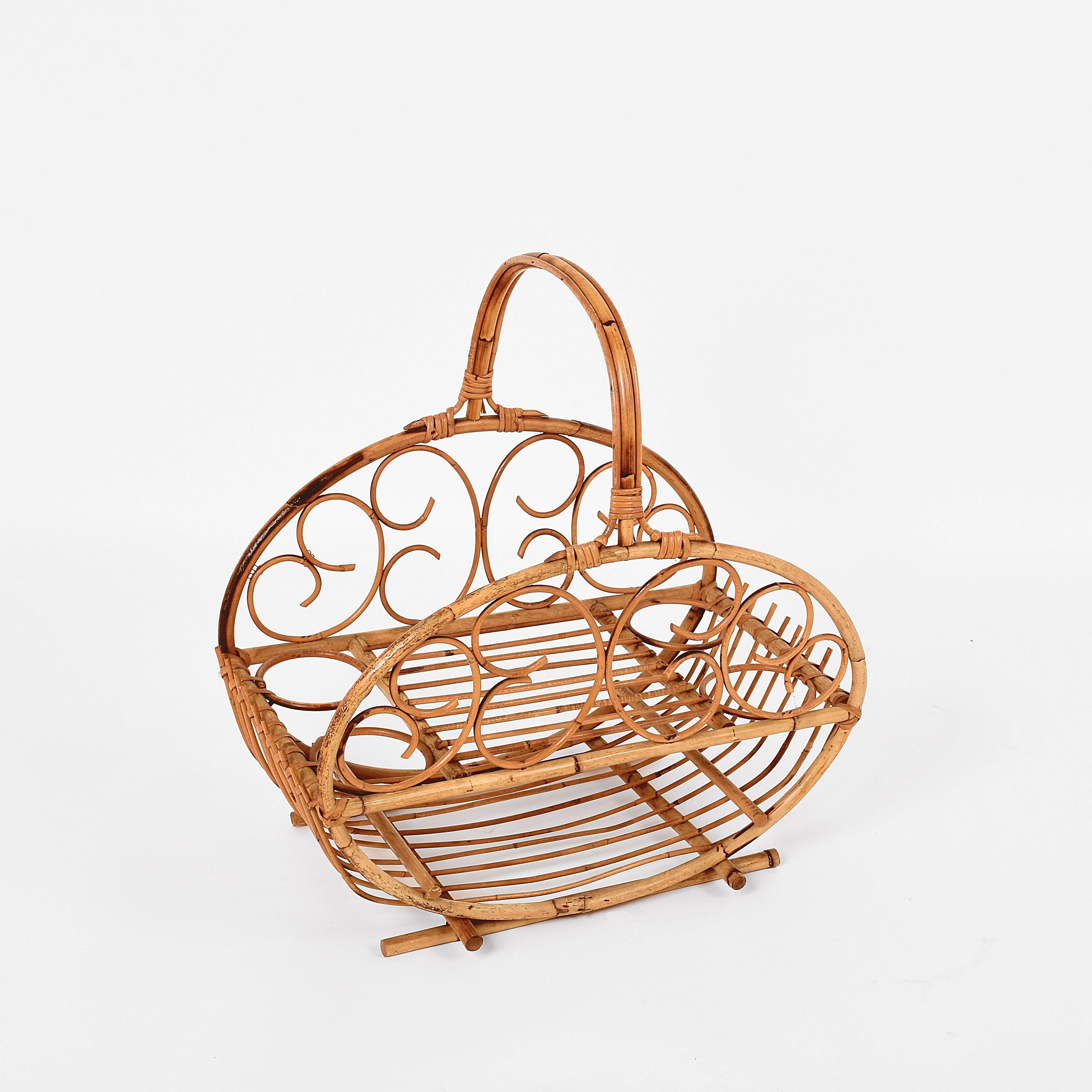 Wonderful magazine rack and a bottle holder. It was produced in Italy during 1960s.

It is made of bamboo and rattan, with two shelves for magazines, a smaller one on the top and a larger one on the bottom. The bottle holders are on the external
