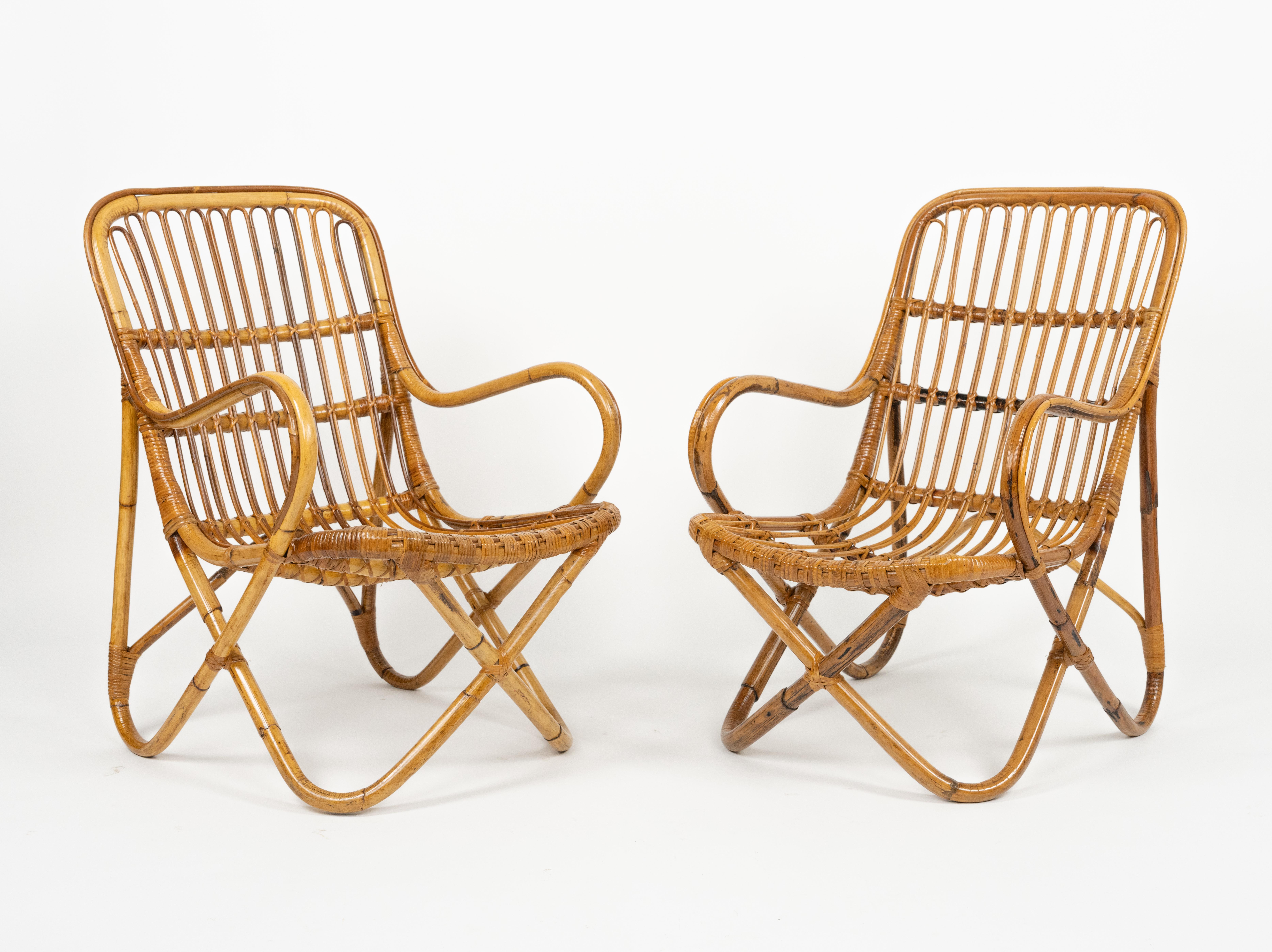 Midcentury amazing pair of armchairs in rattan and bamboo bent in the style of Tito Agnoli for Bonacina.

Made in Italy in the 1960s.

Bamboo / rattan has been polished by a professional restorer.


Tito Agnoli was born in Lima, Peru, in 1931 into