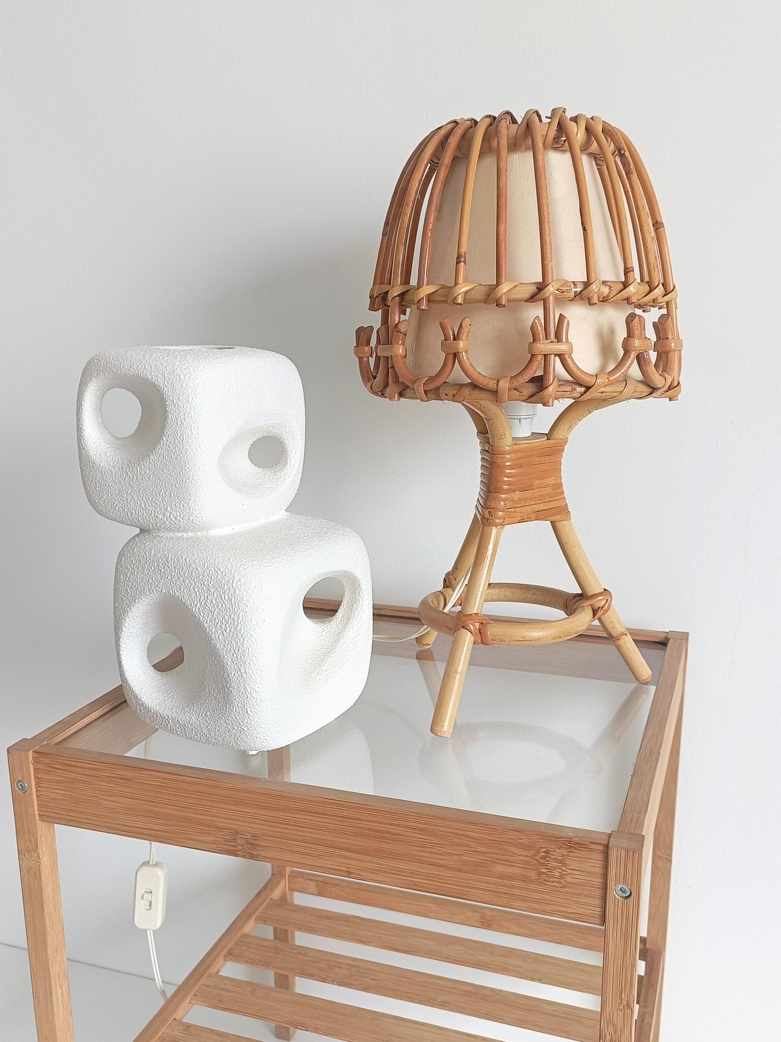 Midcentury Bamboo & Rattan Table Lamp — Attributed to Louis Sognot

French midcentury bamboo and rattan table lamp, attributed to Louis Sognot and in the style of Franco Albini. Clean, sculptural lines with a natural finish. The parchment paper