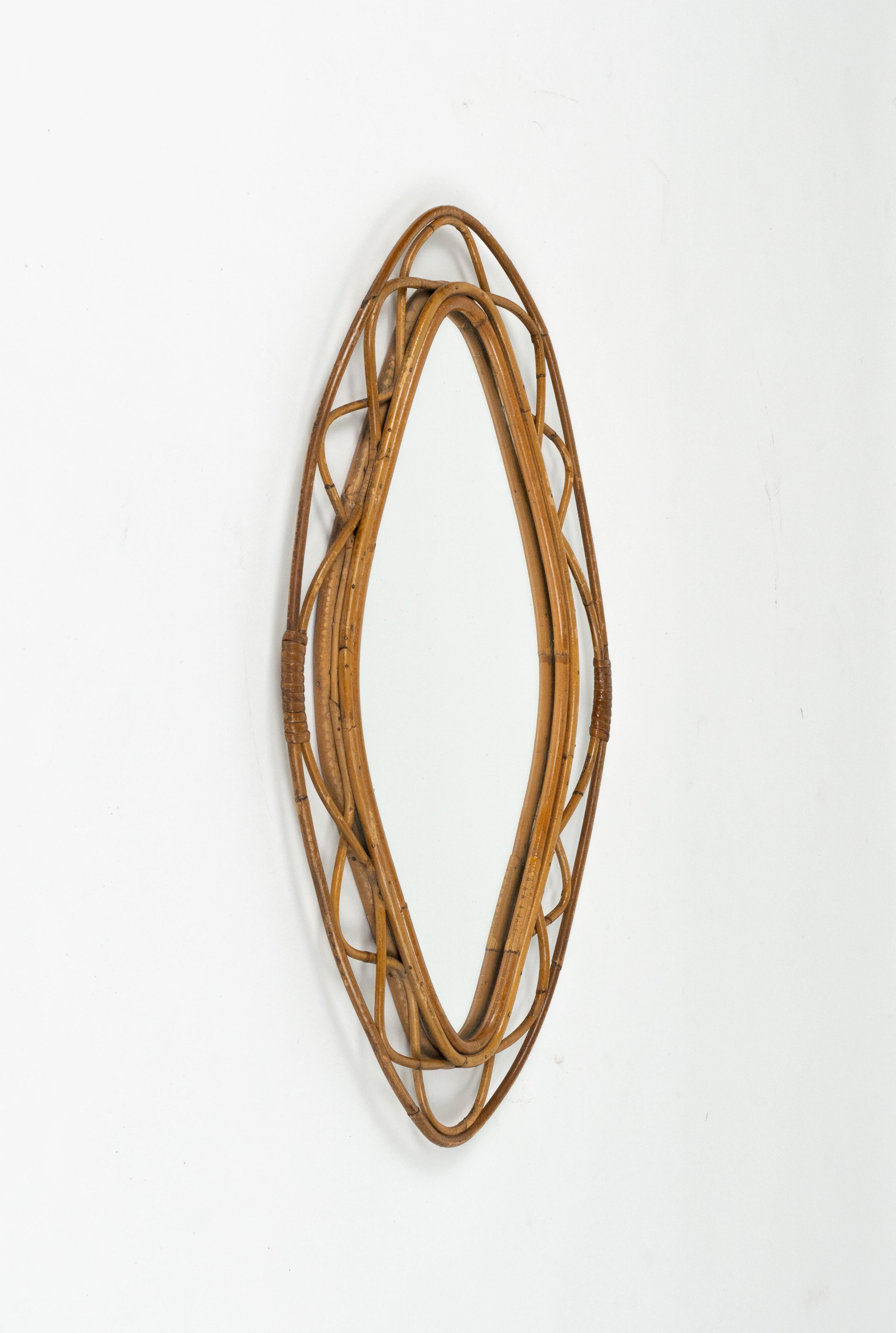 Midcentury amazing double frame wall mirror in bamboo and rattan in the style of Franco Albini.

Made in Italy in the 1960s.  

A highly decorative bamboo and rattan mirror with the taste of the Mediterranean Coast style.