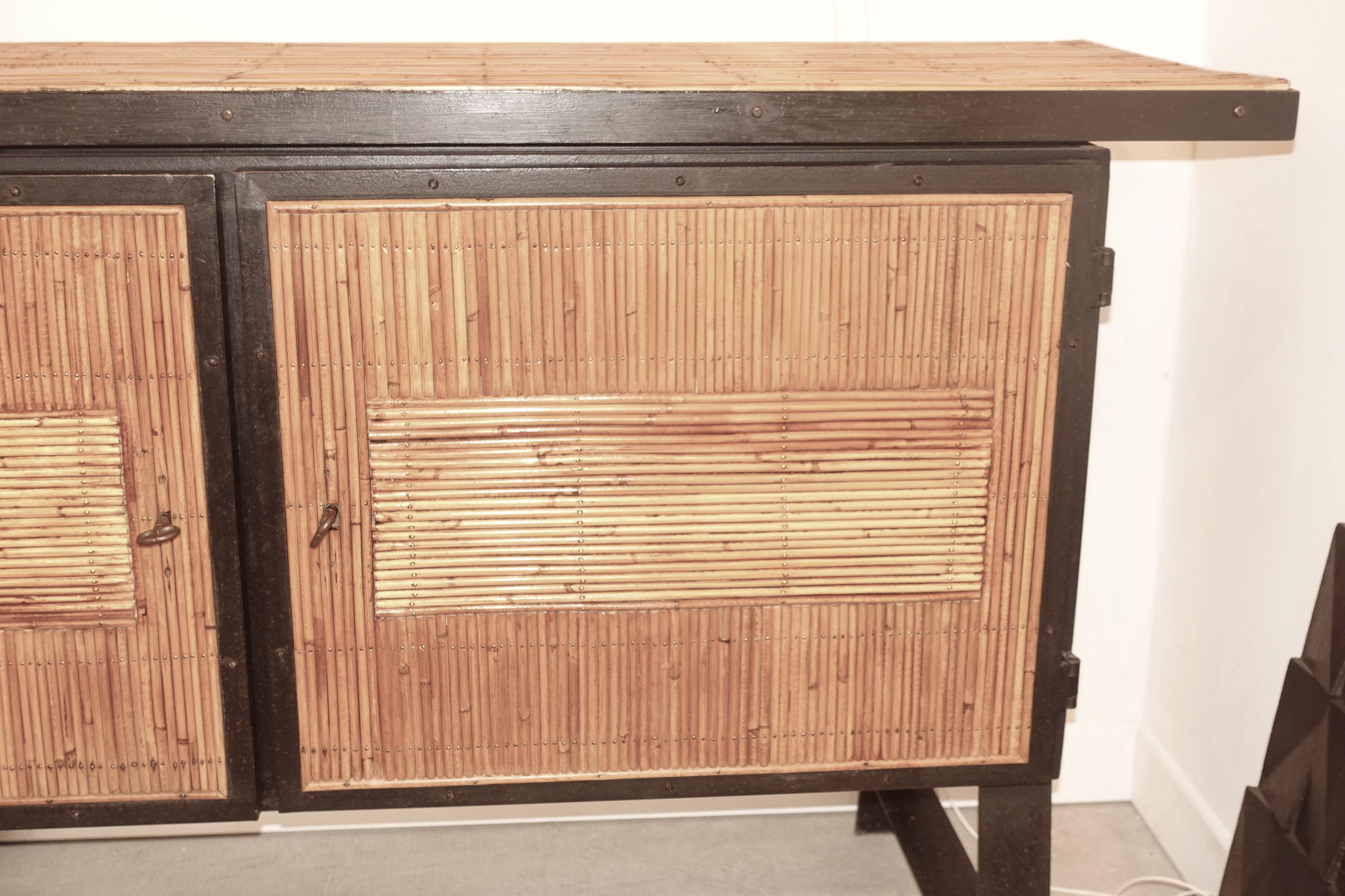 Midcentury French bamboo and black steel trim cabinet.
Steel legs
Two doors
Two inner shelves.
 