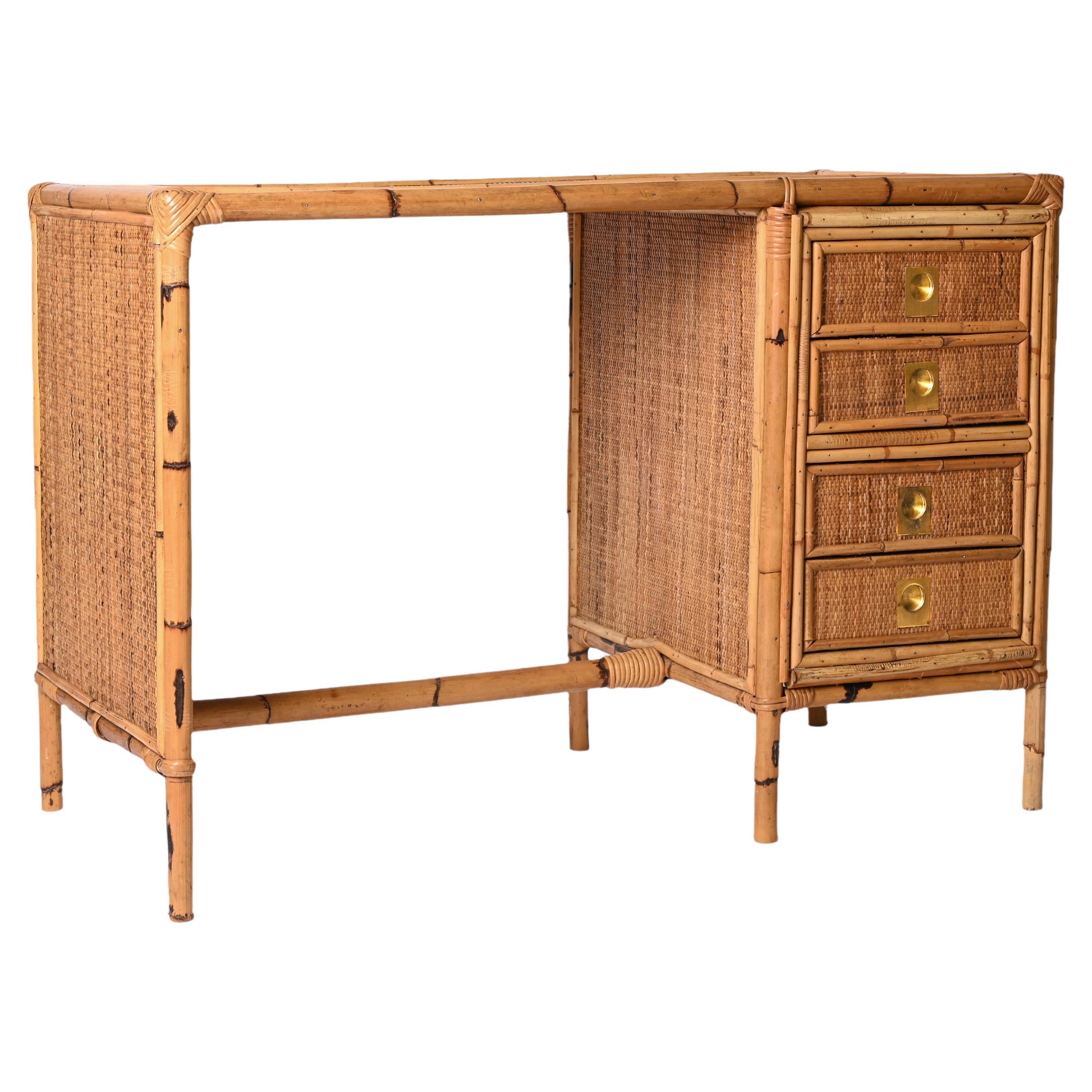 Amazing mid-century bamboo and wicker desk with drawers. This wonderful piece was designed in Italy during the 1980s.

This writing table is unique because of the materials used, bamboo and rattan, and it has four drawers.

A fantastic item that