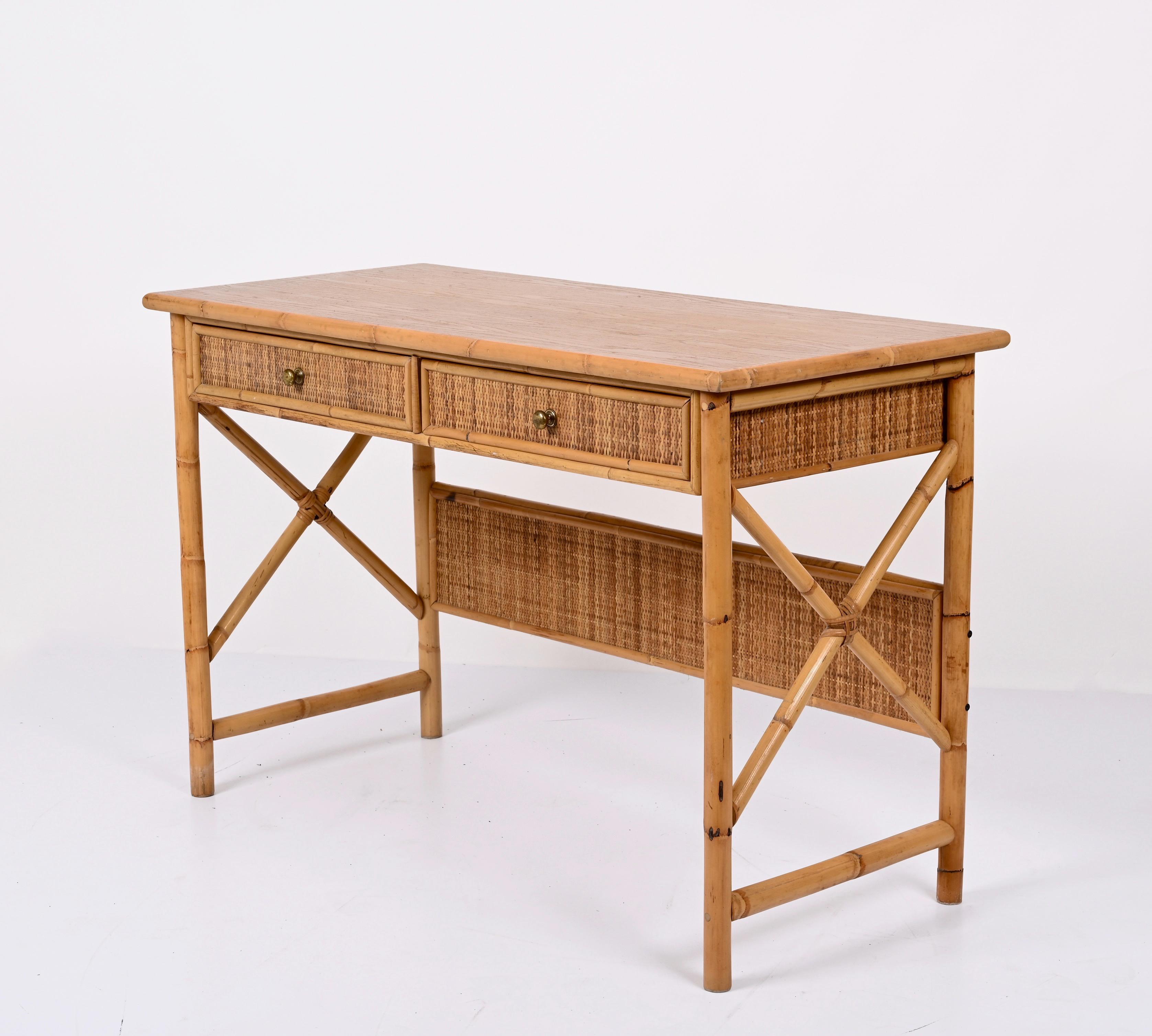 Amazing bamboo and wicker desk with mid century ash wood top with drawers. This wonderful piece was designed in Italy during the 1980s.

This desk is unique because of the materials, ash. bamboo and rattan are perfectly combined. The main