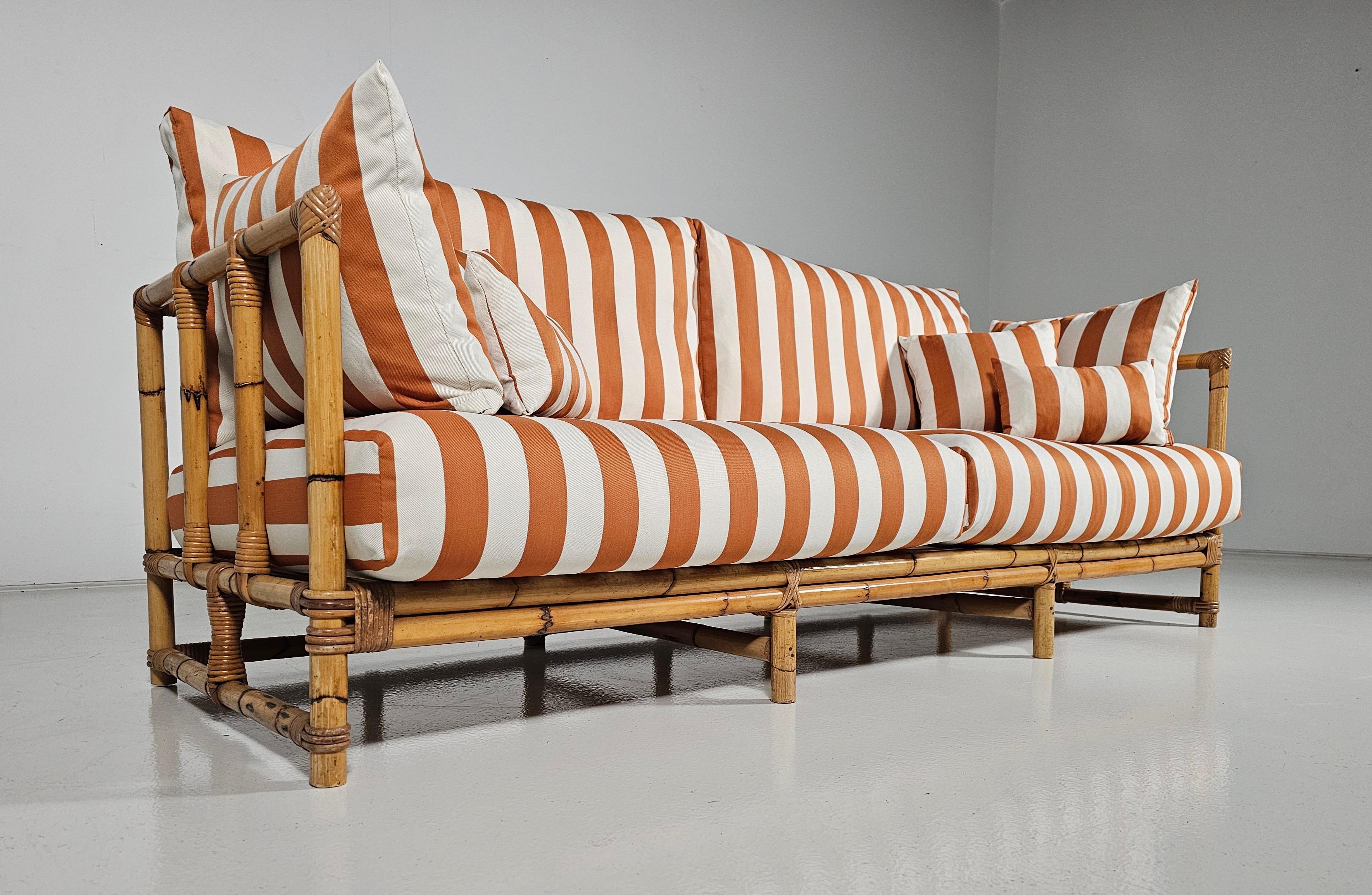 Midcentury Bamboo sofa in orange and cream fabric, France, 1970s.

This exquisite bamboo sofa is from France and made in the 1970s,  Reupholstered in a stunning striped outdoor fabric by Jim Thompson. It also has new cushions that are suitable for