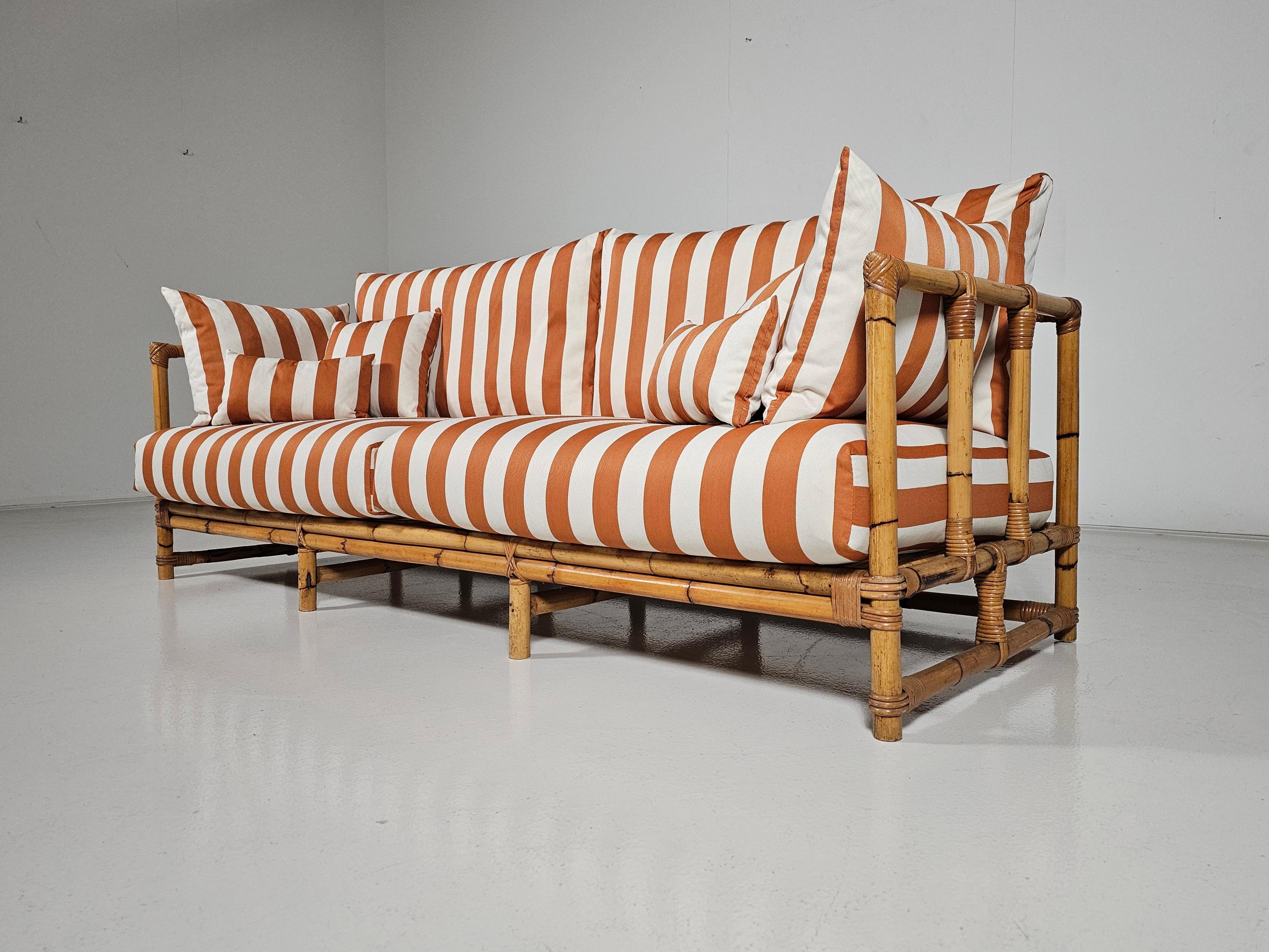 Mid-Century Modern Midcentury Bamboo indoor/outdoor sofa with orange/cream fabric, France, 1960s