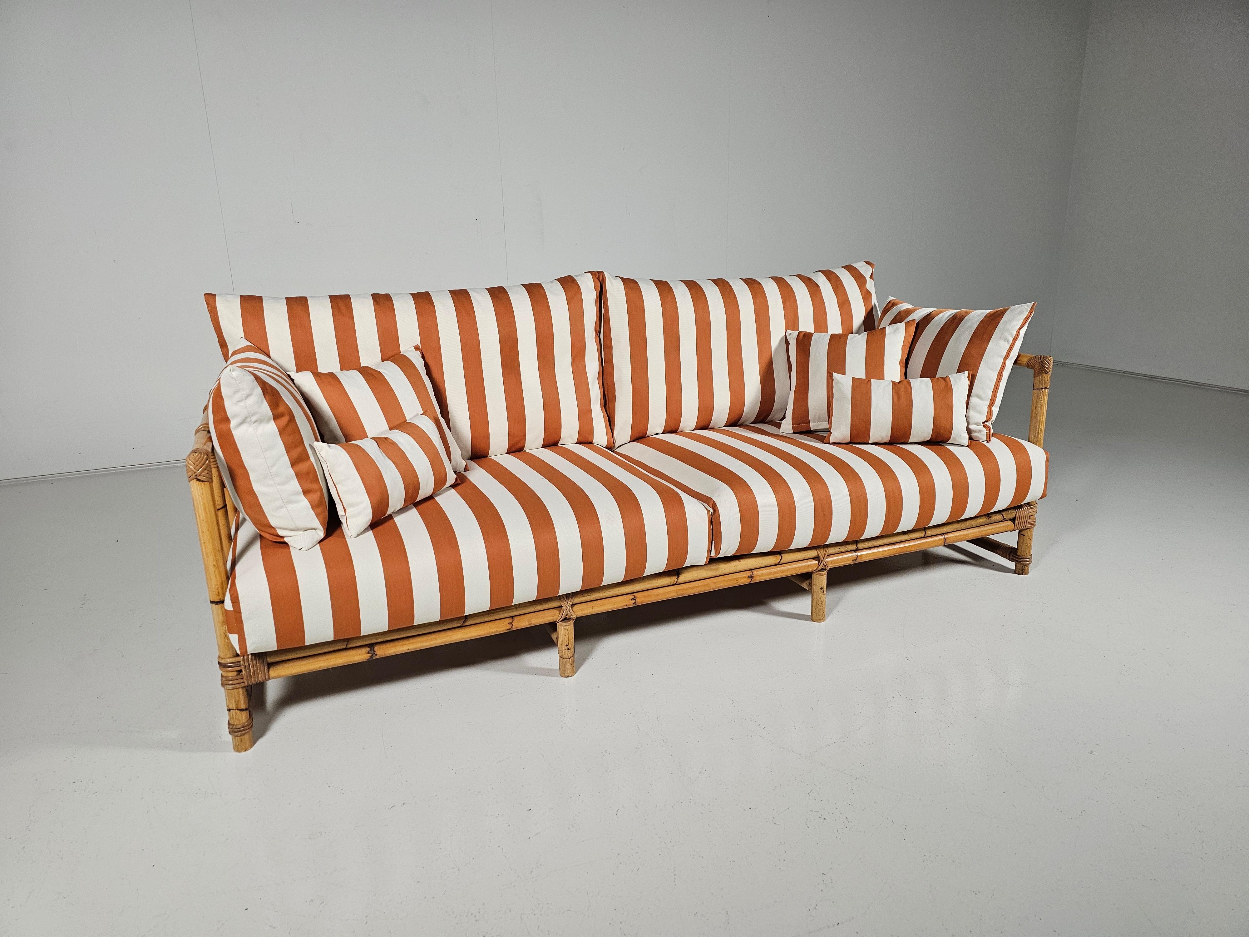French Midcentury Bamboo indoor/outdoor sofa with orange/cream fabric, France, 1960s