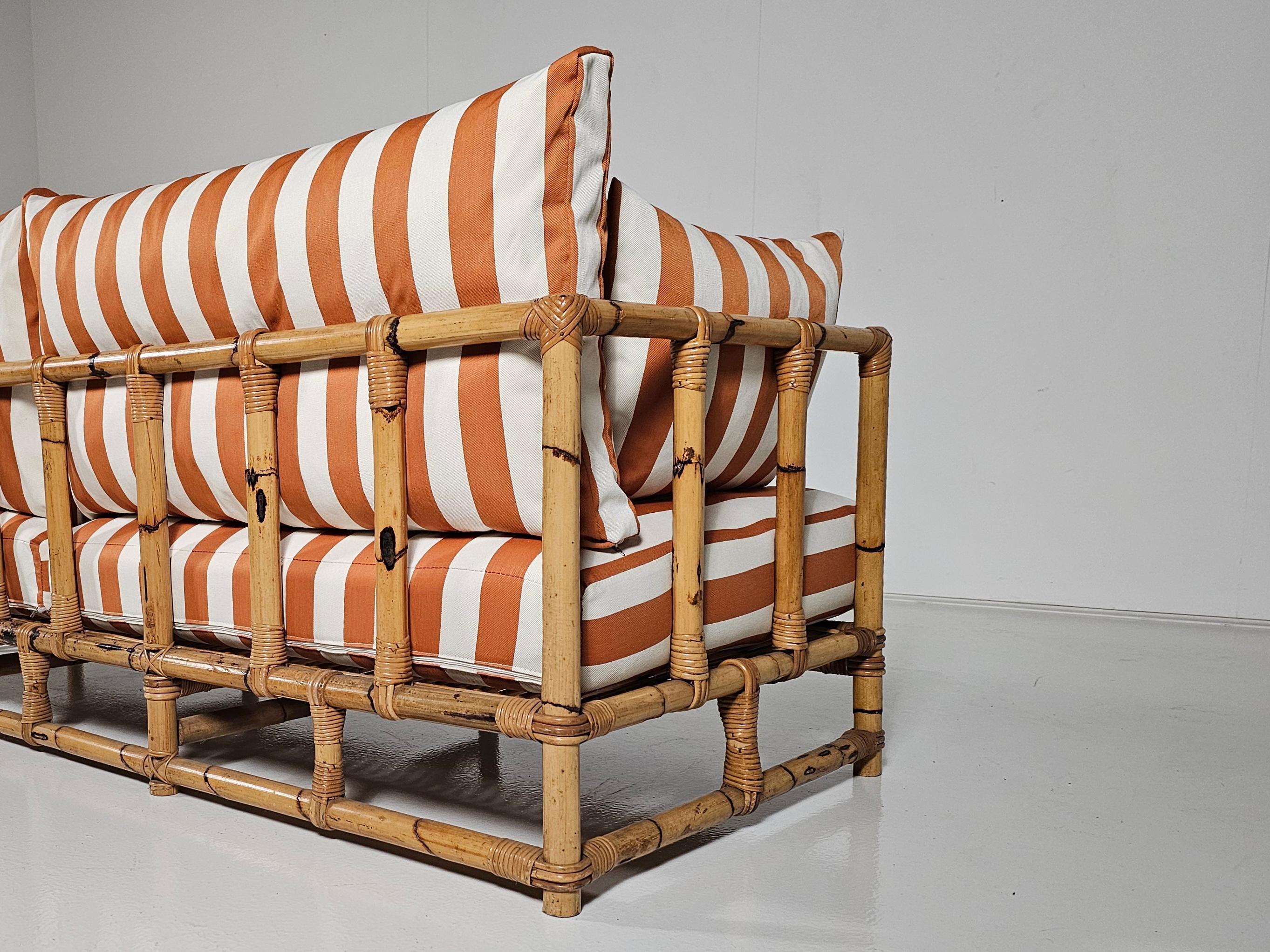 Late 20th Century Midcentury Bamboo indoor/outdoor sofa with orange/cream fabric, France, 1960s