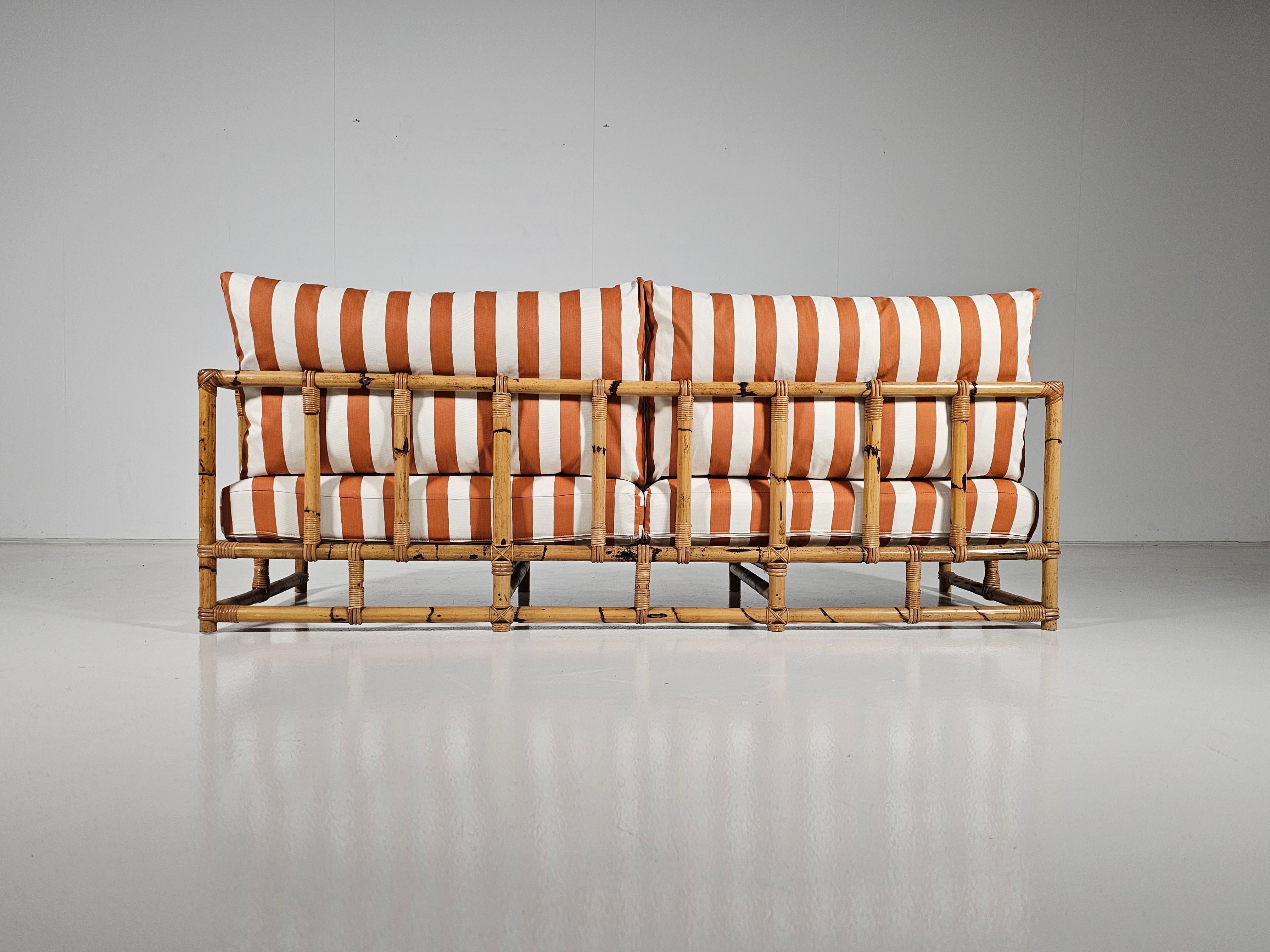 Midcentury Bamboo indoor/outdoor sofa with orange/cream fabric, France, 1960s 1