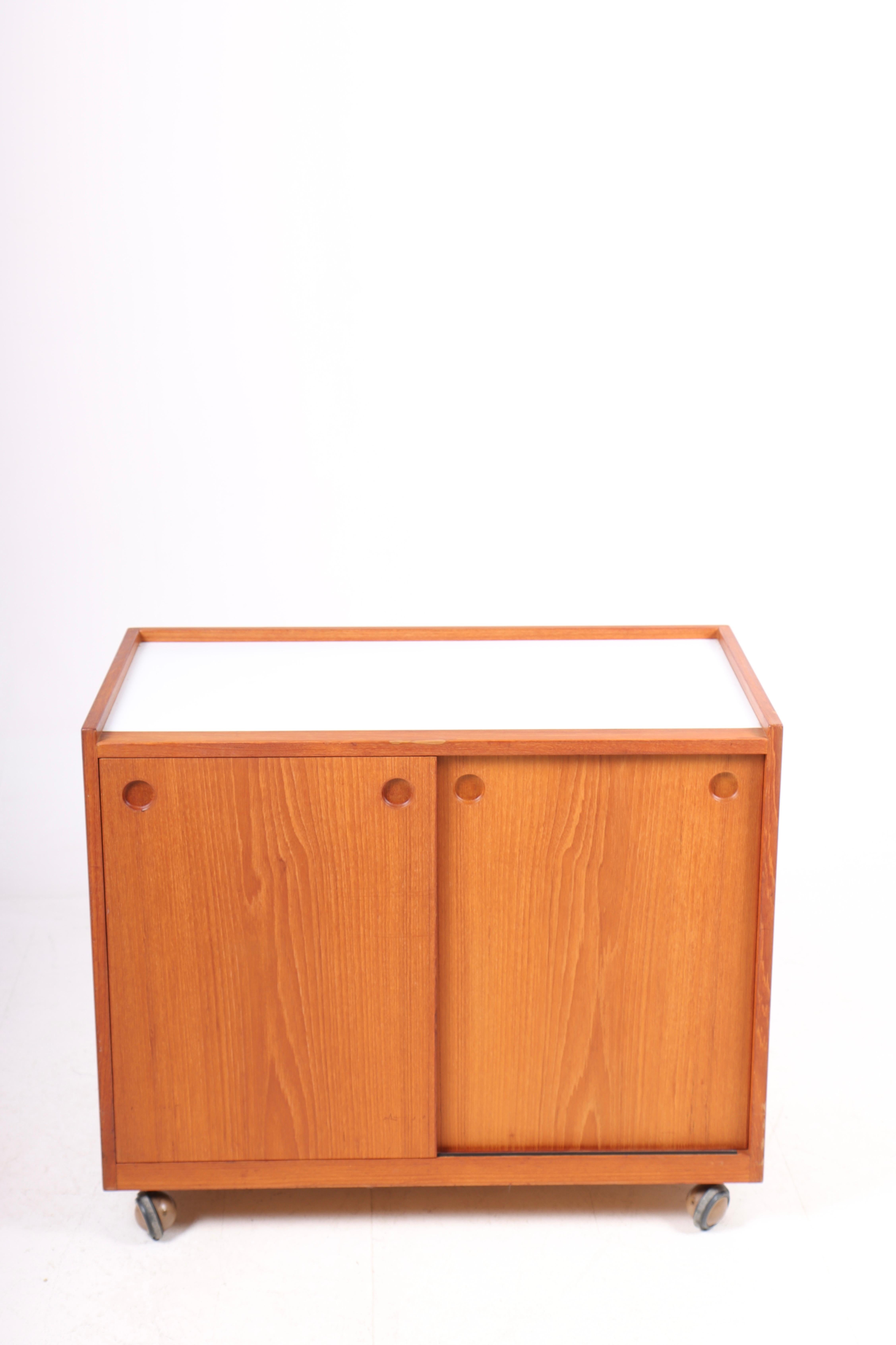 Mid-Century Modern bar cabinet in teak with formica, designed and made in Denmark, 1960s.