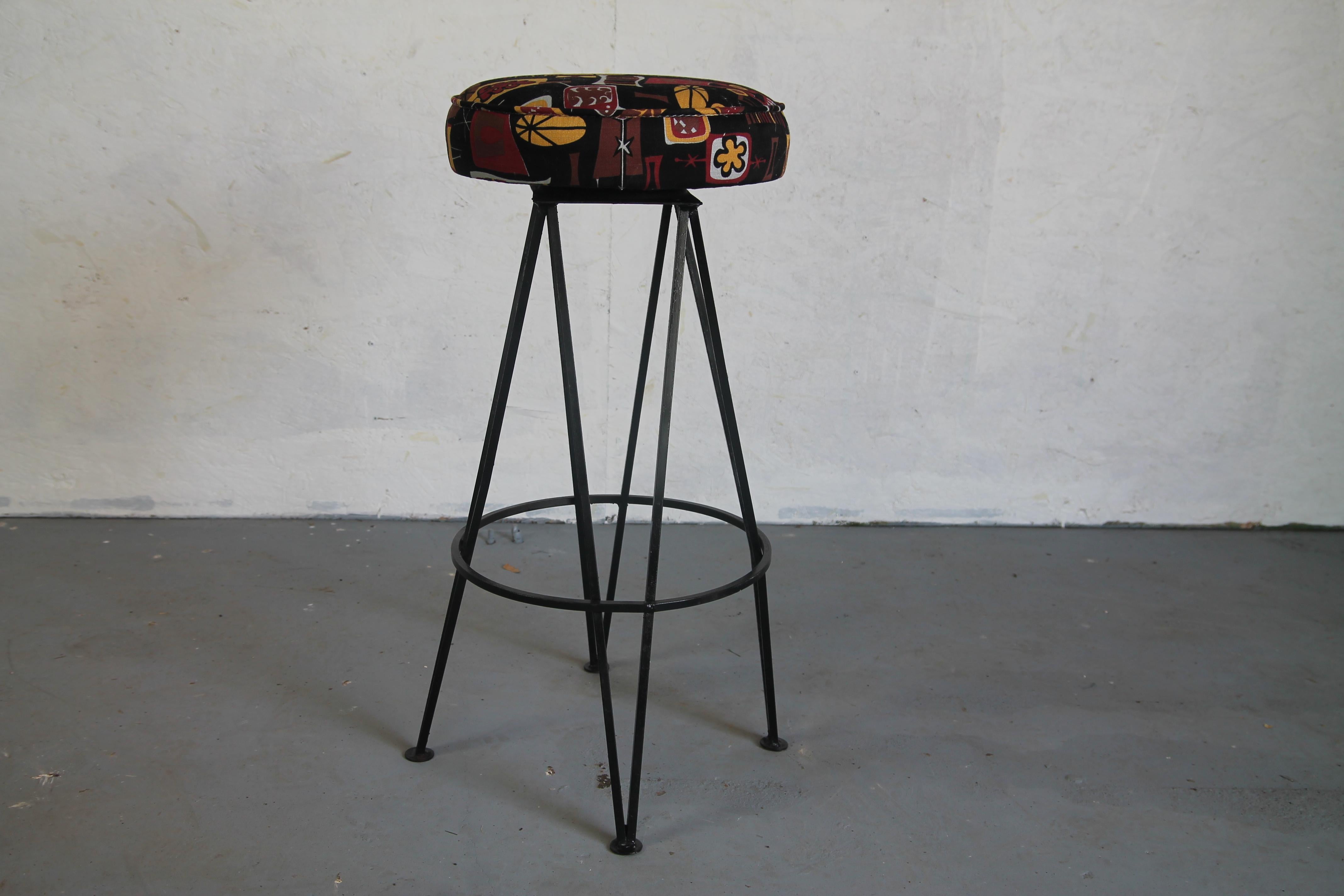 Great set of five iron stools with swivel seats. New tiki fabric.