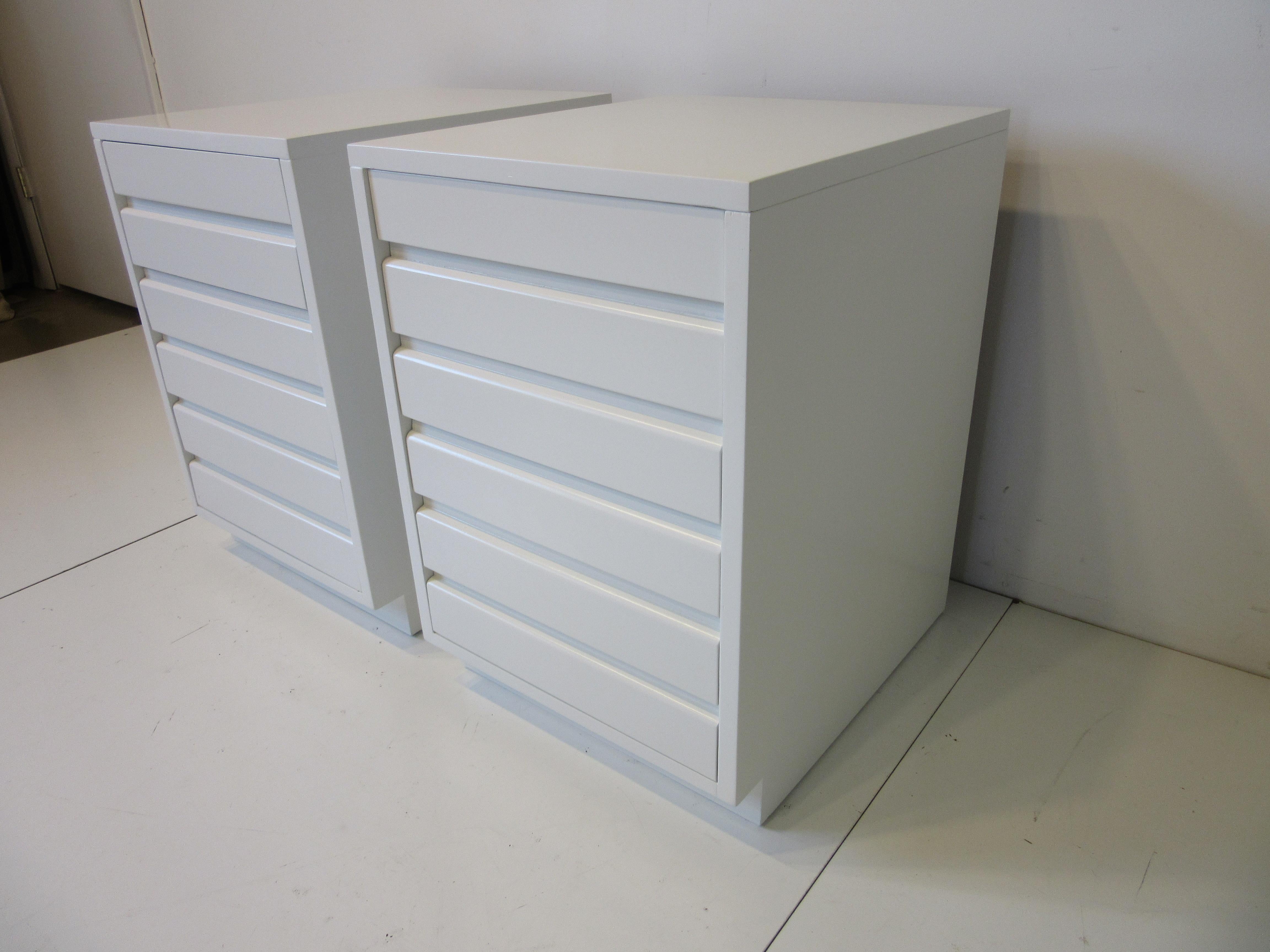 A pair of satin bone white three drawer nightstands that are very well crafted in solid wood unlike furniture today. They work rather well with todays newer higher profile mattresses and retains the manufactures branded mark to the inside drawer and