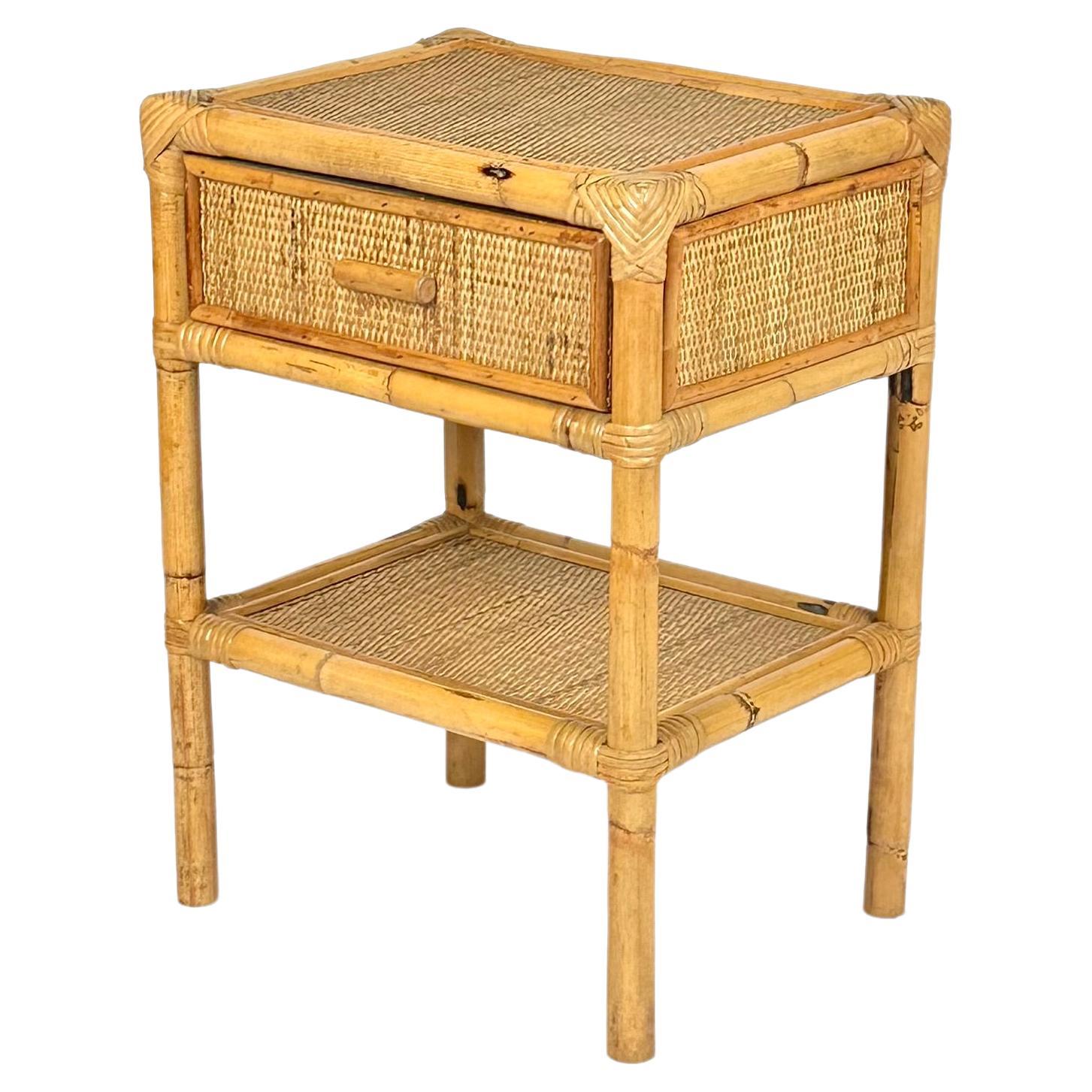 Midcentury bedside table nightstands in bamboo and rattan with drawer and bottom shelf .

Made in Italy in the 1970s.

Perfect in any room as well as next to a sofa or in any bathroom.