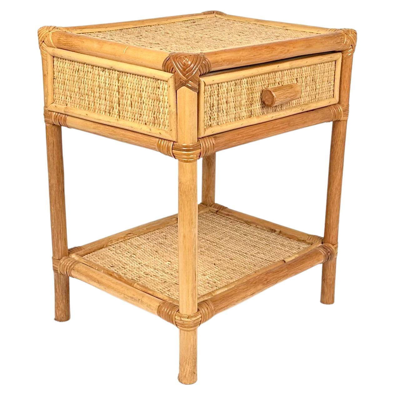 Midcentury bedside table nightstands in bamboo and rattan with drawer and bottom shelf. 

Made in Italy in the 1970s. 

Perfect in any room as well as next to a sofa or in any bathroom.