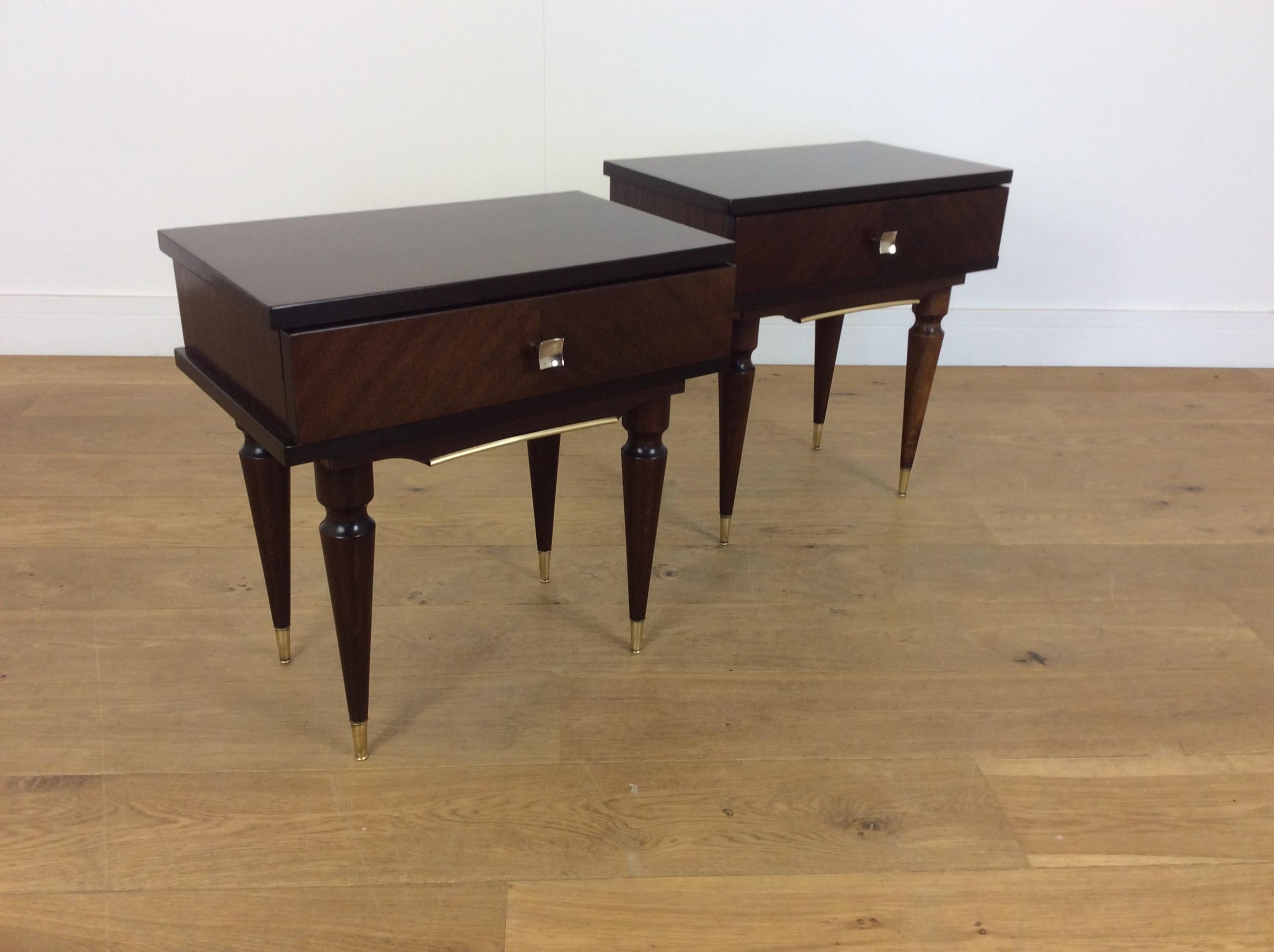 Midcentury nightstands.
A pair of mid century bedside tables in a Mahogany with polished brass detail.
Measures: 51 cm H x 50 cm W x 31 cm D
Italy, circa 1960.