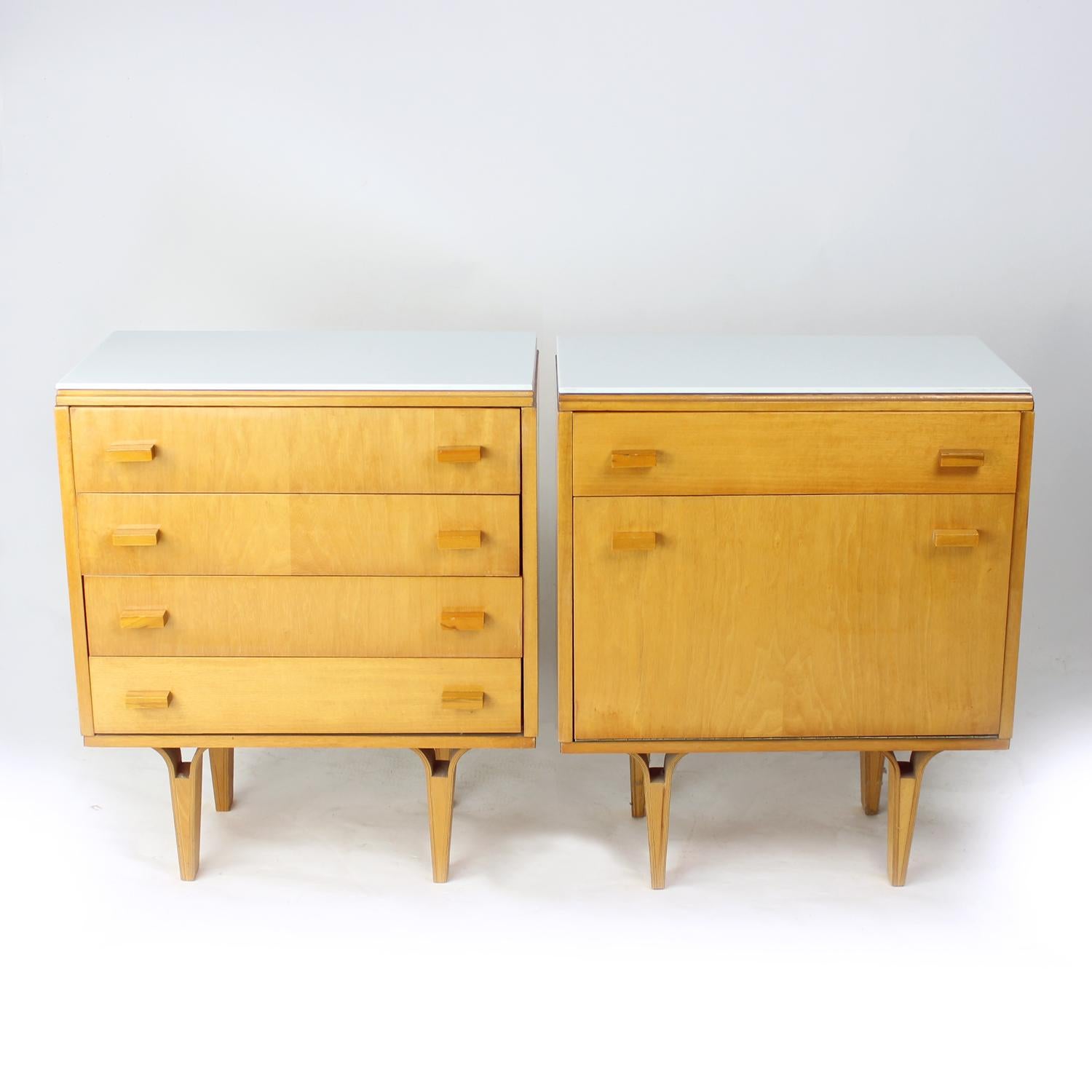 Set of two beautiful mid-century bedside tables. Produced by Novy Domov company in 1960s. The original labels still attached on the back. The tables are made of beautiful light blong oak wood with high sheen finish. One table has four drawers. The