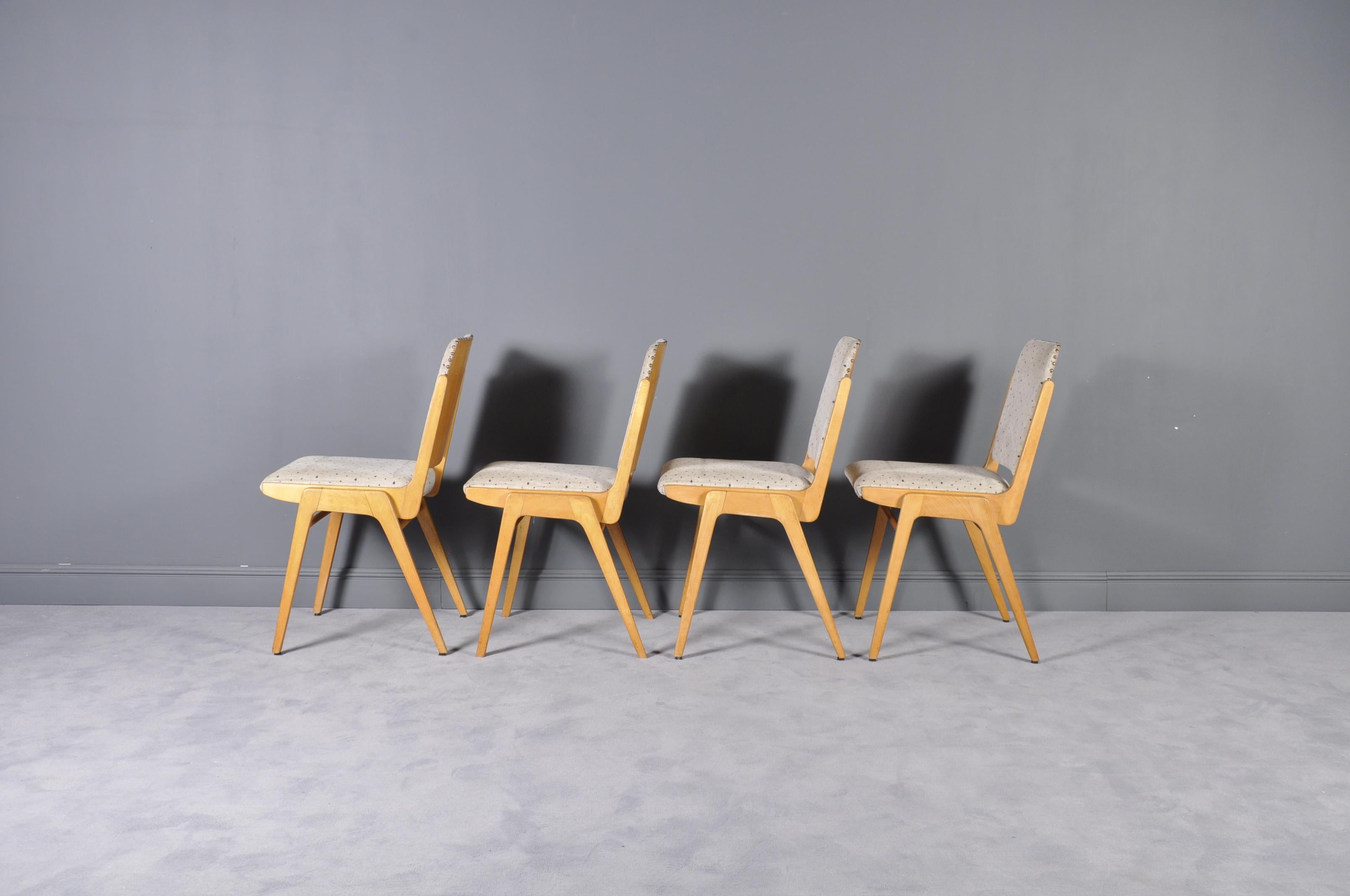 These stackable dining chairs were designed by Franz Schuster for the Forum Stadtpark Graz in 1959. They were also named Austro Chairs and were produced by Wiesner-Hager in Austria. The frames are made of solid natural beech and plywood, while the