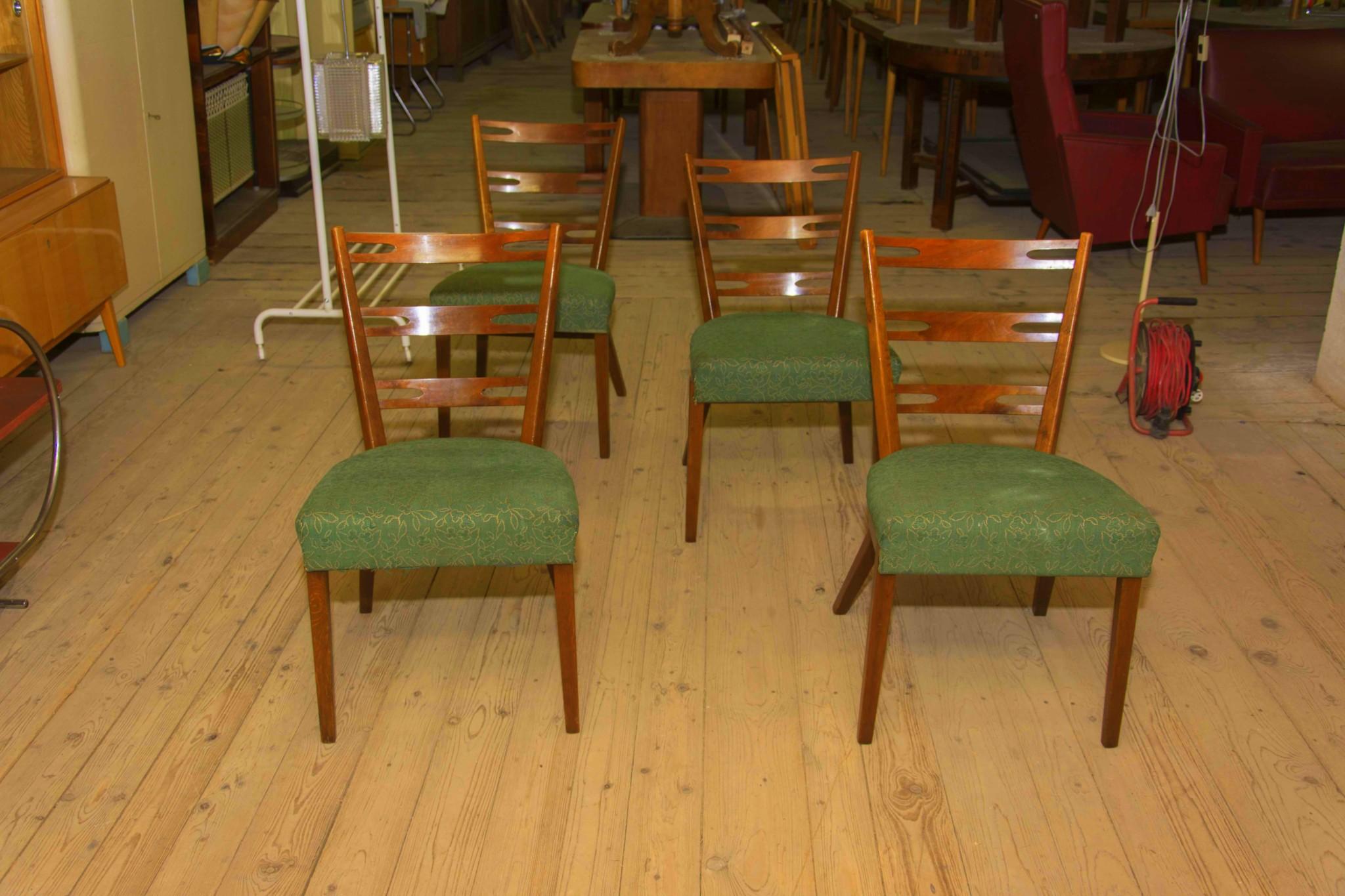 Midcentury dining chairs, made in Czechoslovakia in the 1960s, it features original green fabric and beechwood structure. The chairs are generally in very good Vintage condition. Price is for the set of four.

Height: 82 cm

width: 46 cm

depth: 53