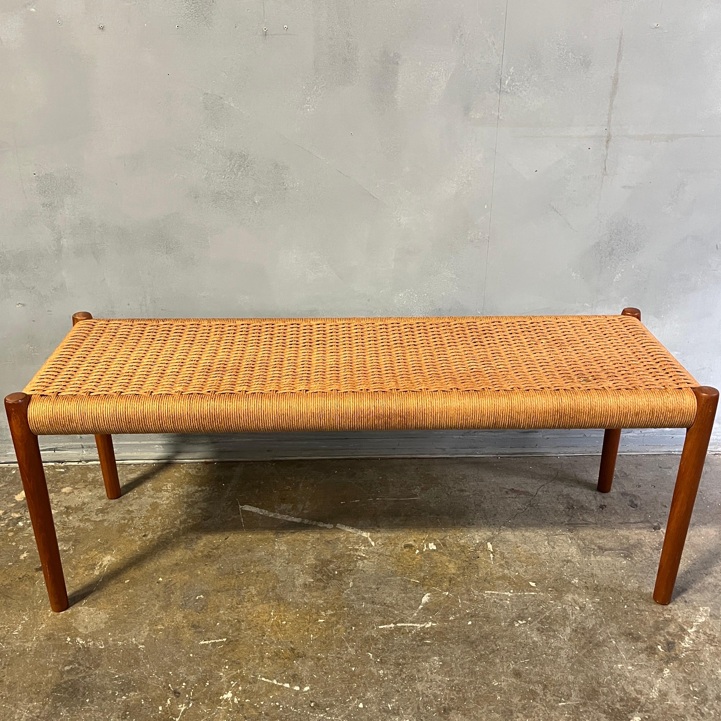 A teak bench with paper cord woven seat. Designed by Niels O. Moller. Model 63A.

Vintage original Danish teak bench in very good original condition.