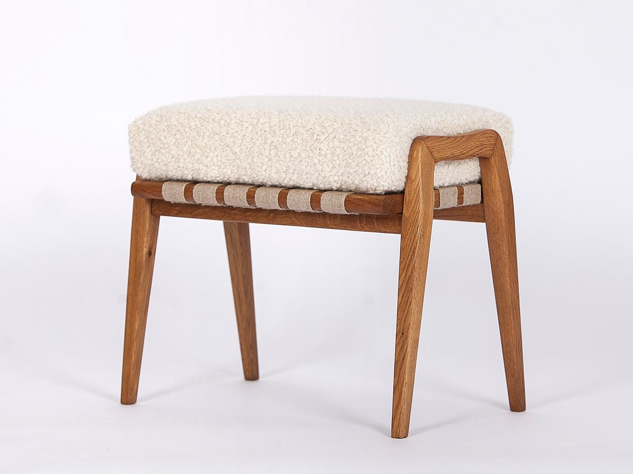 This midcentury stool footstool was made in the 1960s in former Czechoslovakia. Solid ash with hemp straps. The removable upholstery consists of a coconut fiber core, covered with a wonderful bouclé fabric made of soft wool and alpaca from the