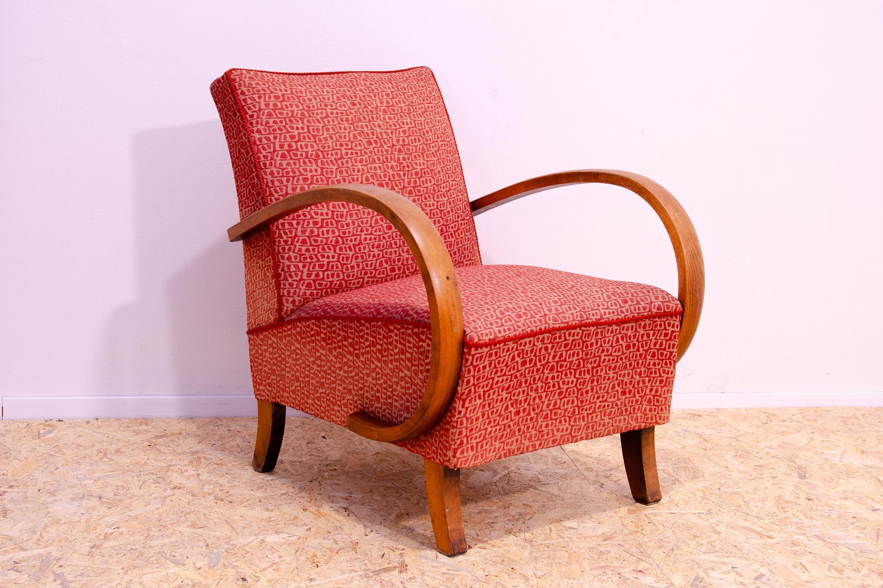 This midcentury bentwood “”C”” armchair was designed by Jindřich Halabala and produced by UP Závody in the 1950´s. The chair is stable and comfortable and is in good structure condition. The fabric showing signs of age and wear(fading on the back