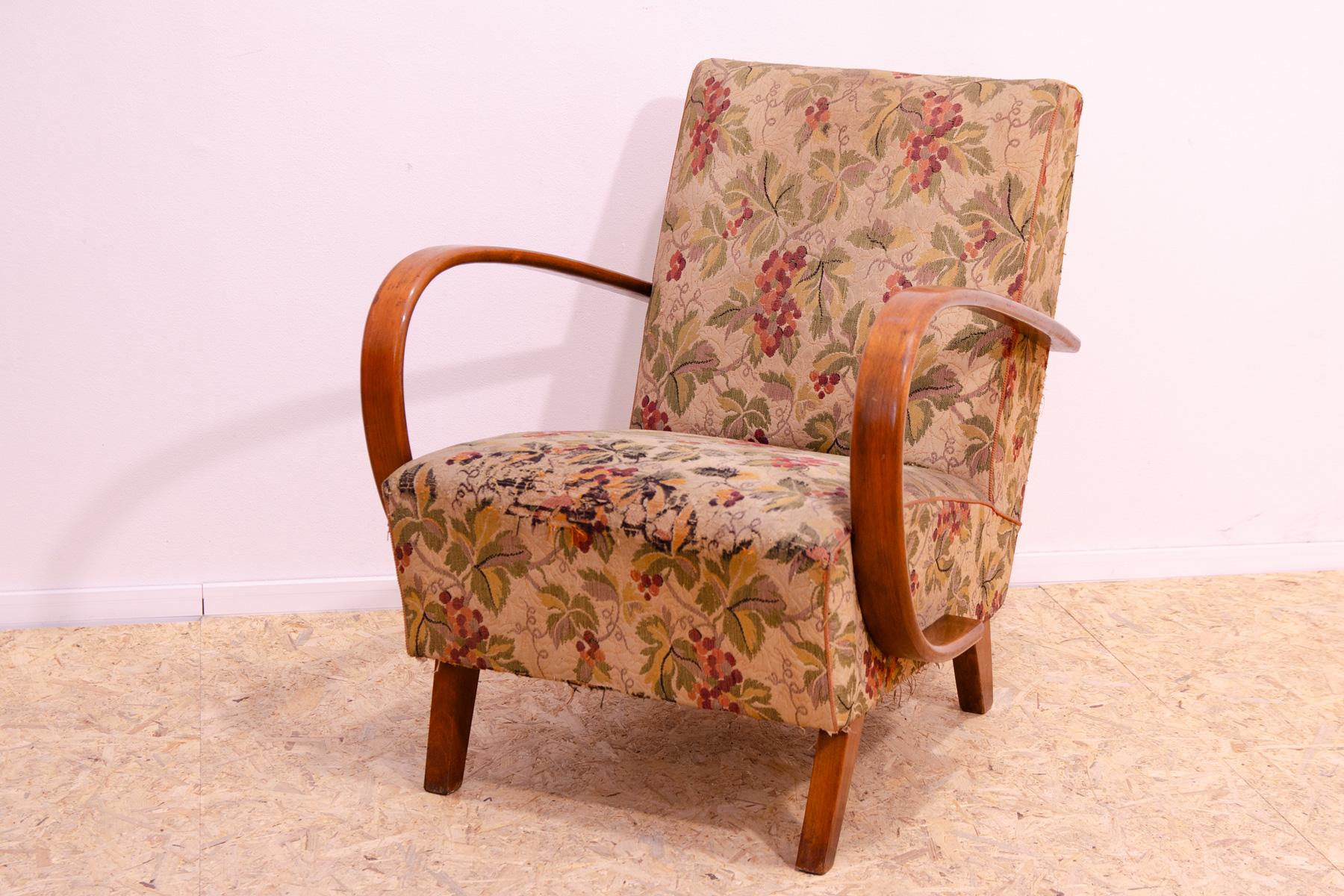This midcentury bentwood “”C”” armchair was designed by Jindřich Halabala and produced by UP Závody in the 1950´s. The chair is stable and comfortable and is in good structural condition. The fabric showing signs of age and wear(fading and small