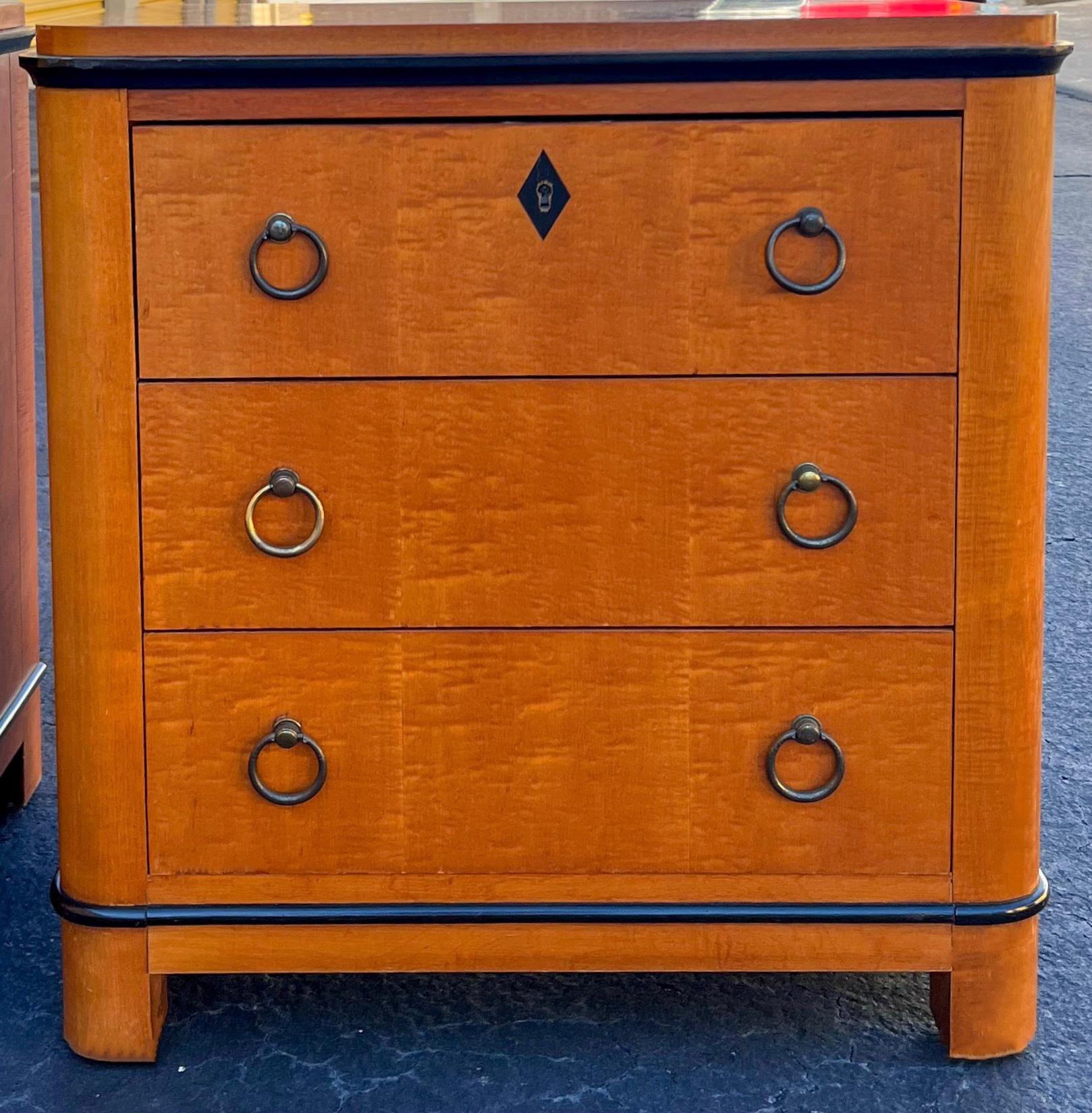 This is a versatile pair of chests. They have Biedermeier styling and could work as side tables or chests. They are by National Mt. Airy. They appear to be cherry with a pinstripe inlay and do have dovetail construction.