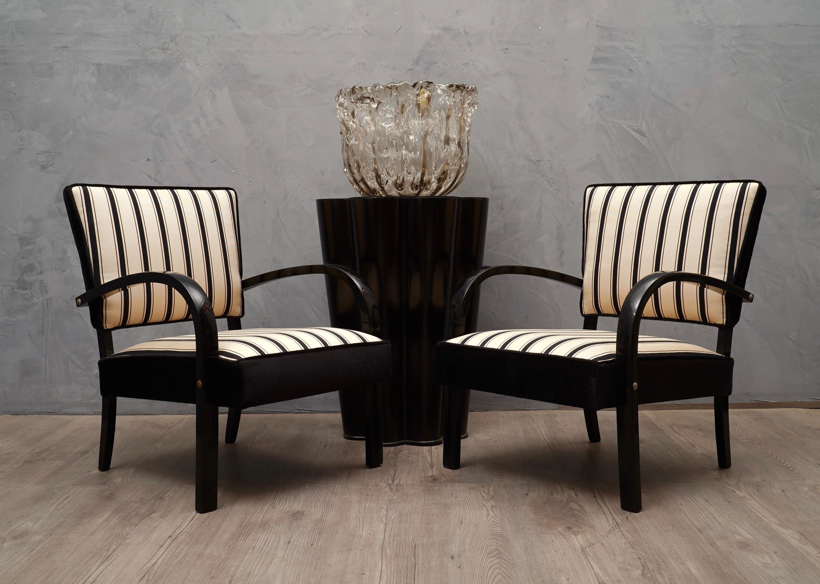 Very elegant appearance due the use of not common fabric, coming from particular Italian silk factory, this gentle upholstery gives these armchairs a very luxurious appearance.

All covered with two types of combined velvet and fabric. One black and