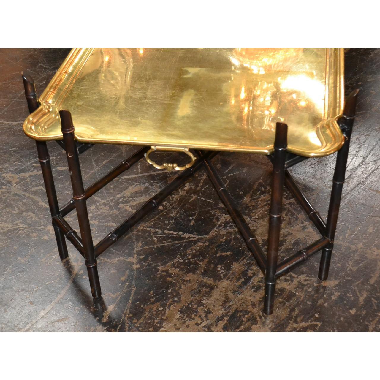 Wonderful little table for entertaining with its removable solid brass tray. Made in the midcentury possibly by furniture manufacturer Baker,
circa 1960.