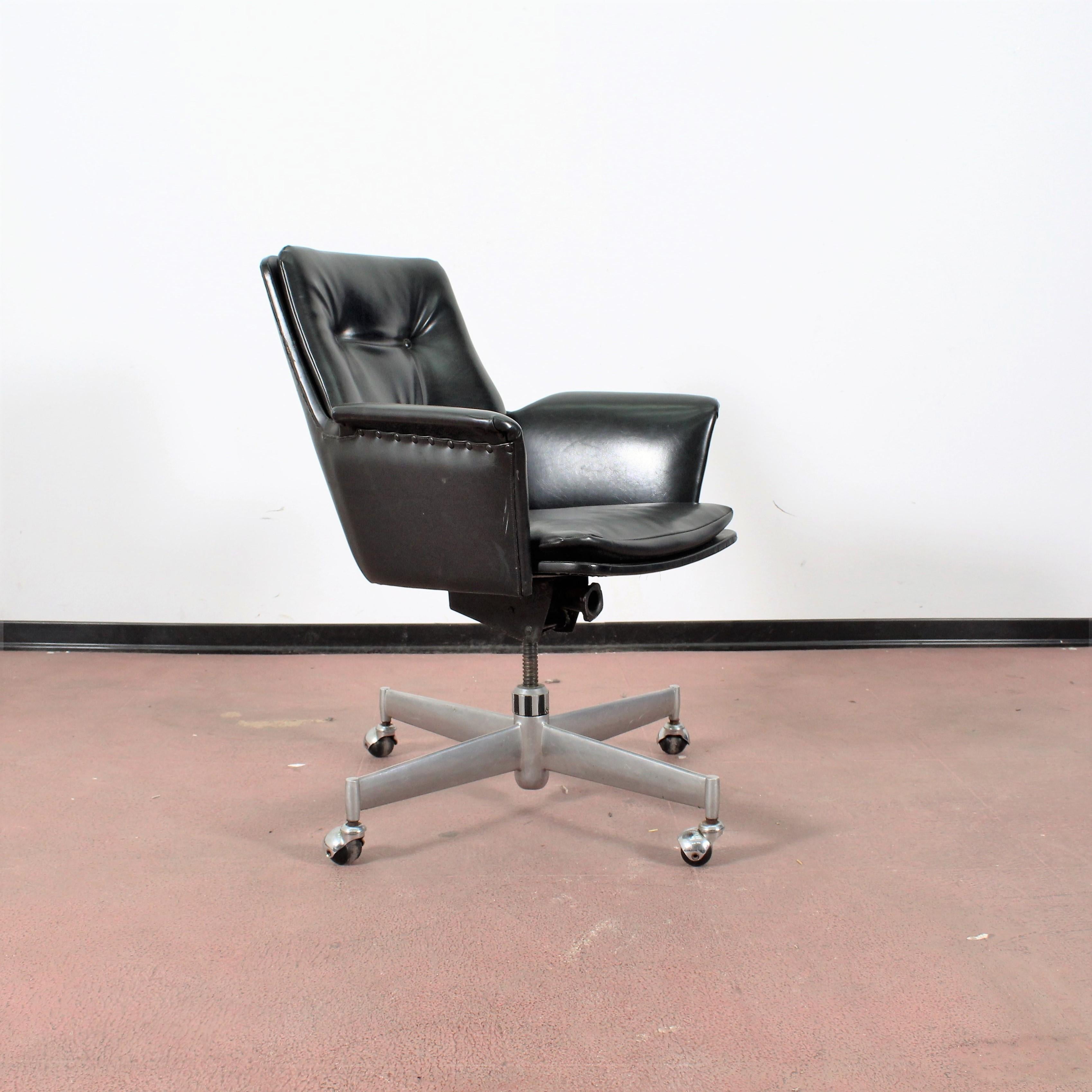 Mid-Century black leather Italian desk chair, 1960s.
Wear consistent with age and use.
 