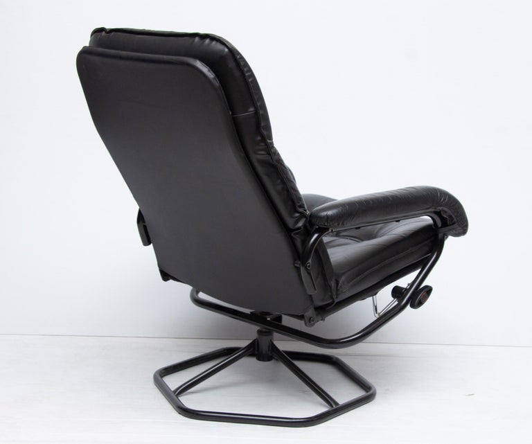 Midcentury Black Leather Reclining Armchair and Ottoman at 1stDibs
