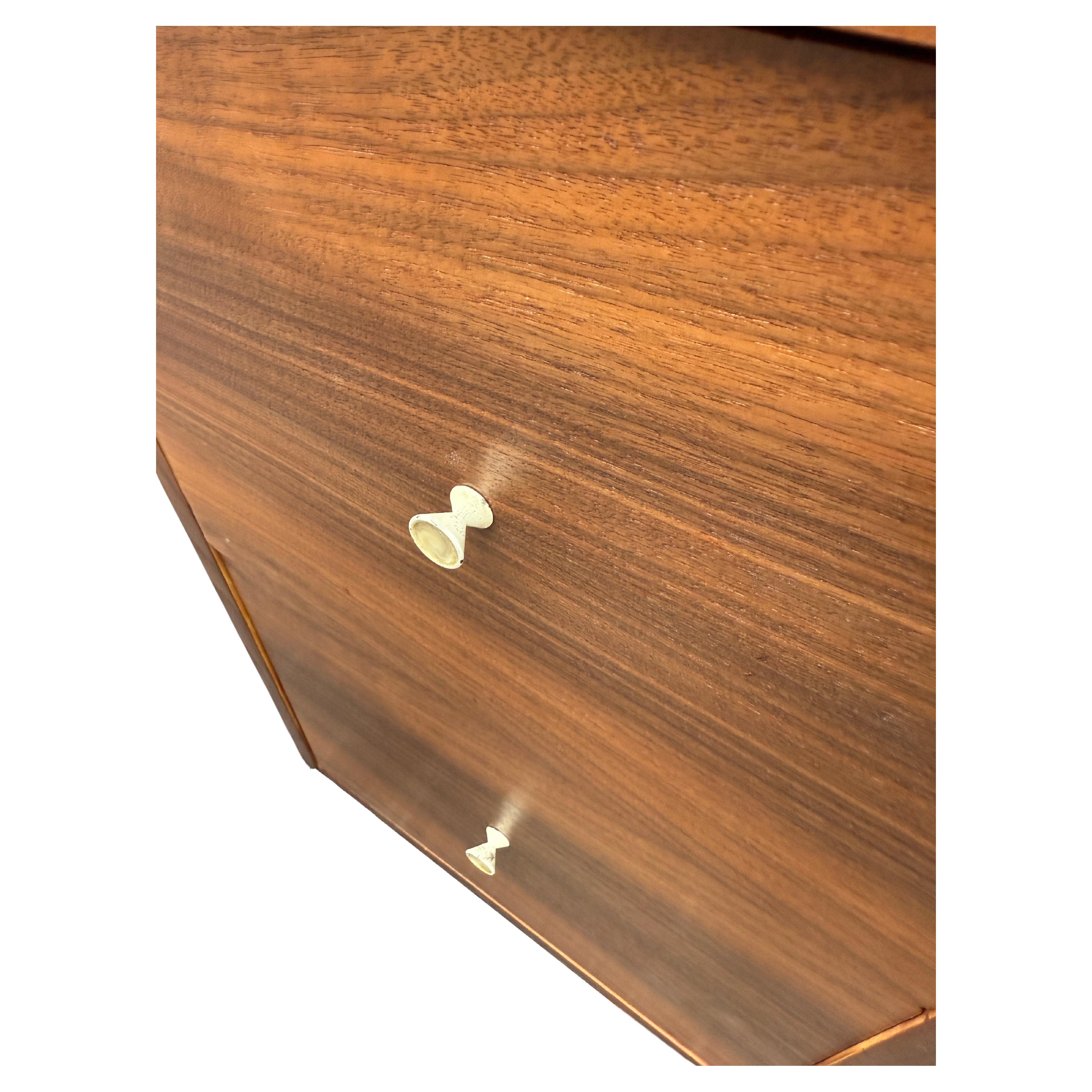 Hard to find Mid-Century file cabinets in walnut with this styling, Two drawer cabinet that fits letter sized files. Finished back. 

Practical and visually appealing. 

Photos taken outside on a sunny day in the shadows. Expect the cabinet to be a