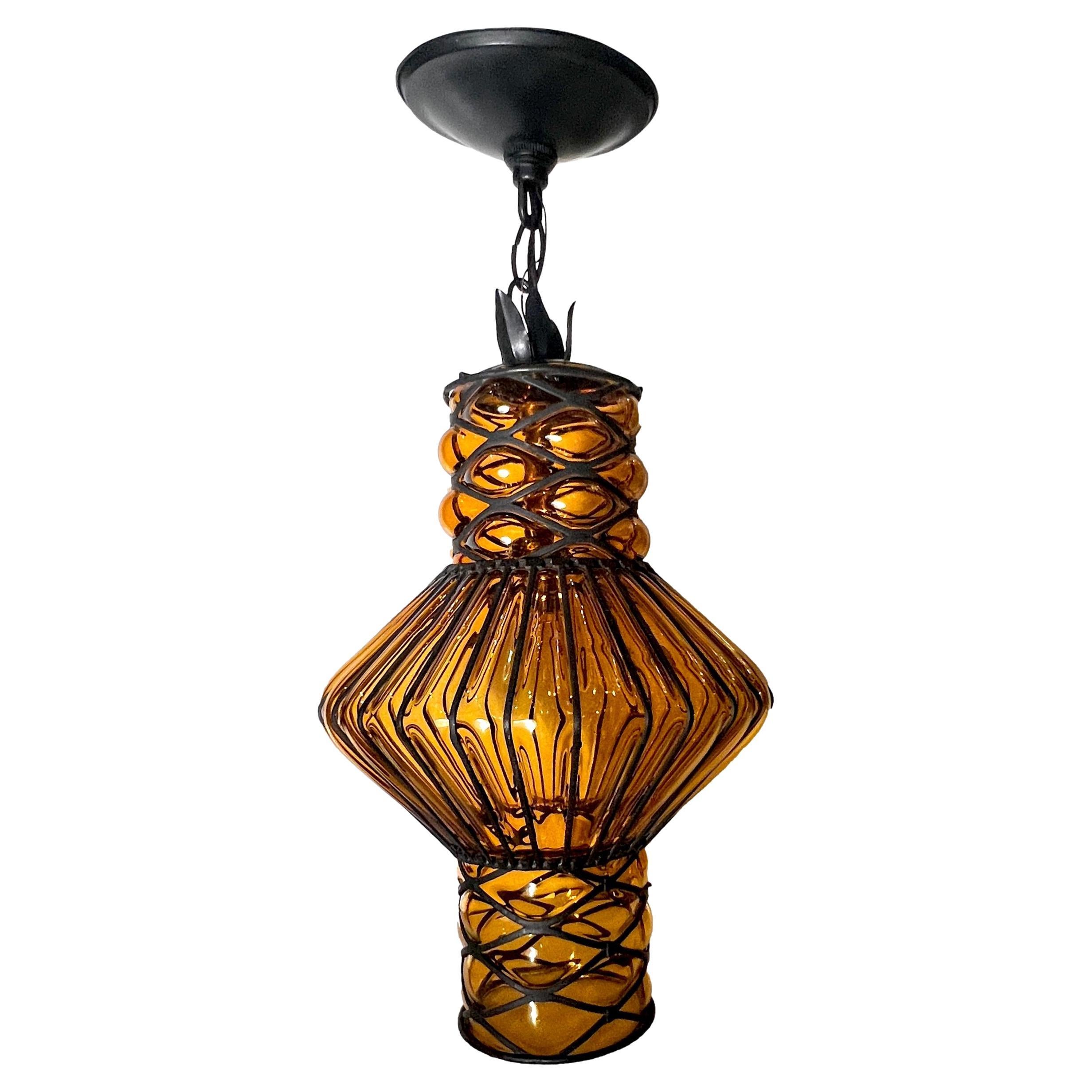 An Italian circa 1950's blown glass and iron lantern with interior light. 

Measurements:
Current drop: 21