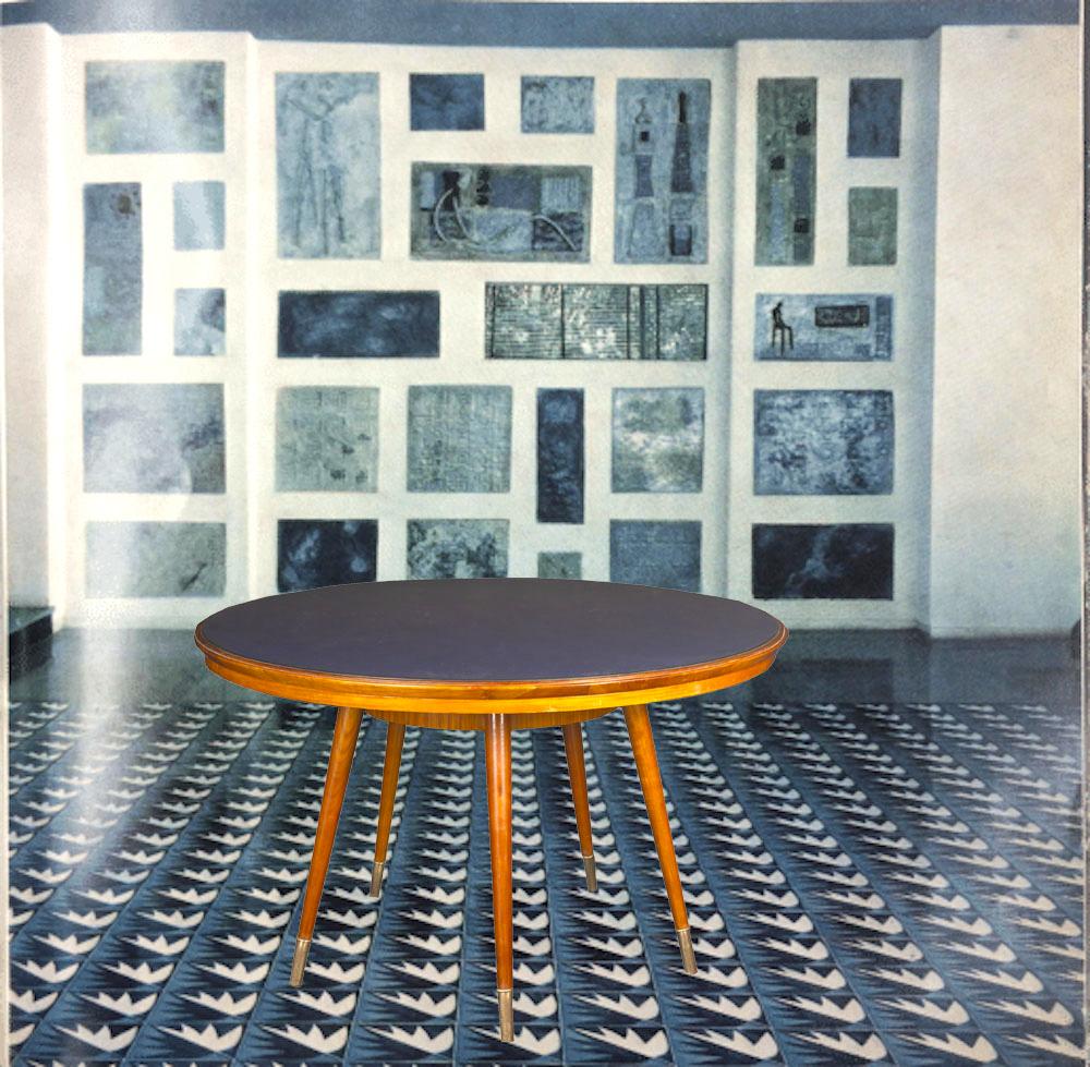 Rare midcentury round blue top dining or center table resting on four brass sabots legs.attribution to Gio Ponti.
Similar tables were designed by Ponti for the iconic Roman Hotel Parco dei Principi.