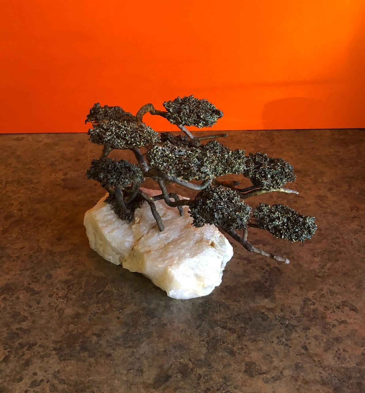 A very nice midcentury Bonsai tree sculpture of brass and bronze on a rugged onyx base by Mario Jason, circa 1970s. The piece is signed and still has its original tag attached.