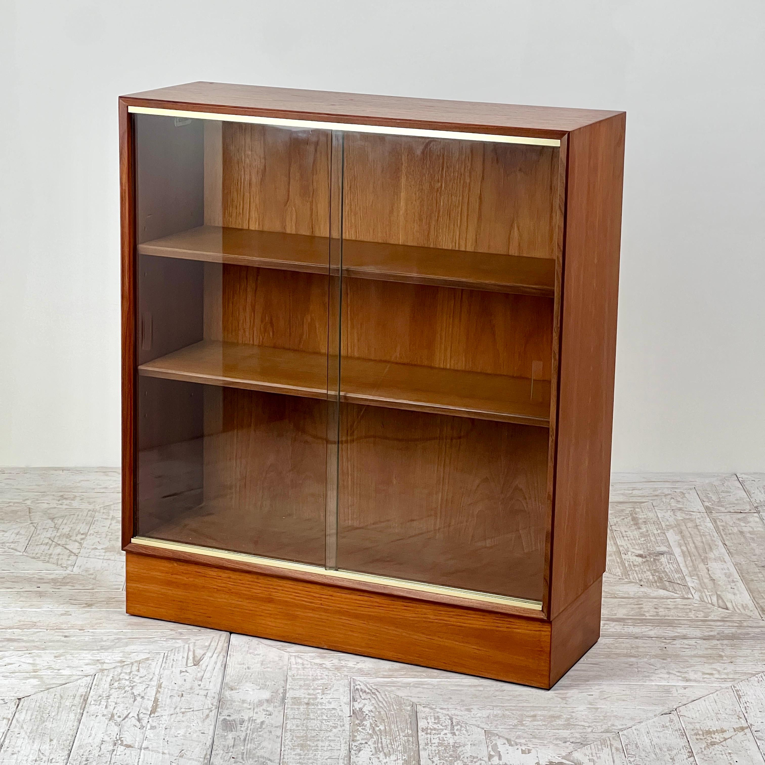 A smart Midcentury Bookcase by Minty of Oxford (Four available). Crafted with a focus on clean lines and a rich wood grain, this bookcase exudes timeless elegance.

The unit has been thoroughly deep cleaned and waxed, ensuring its aesthetic appeal
