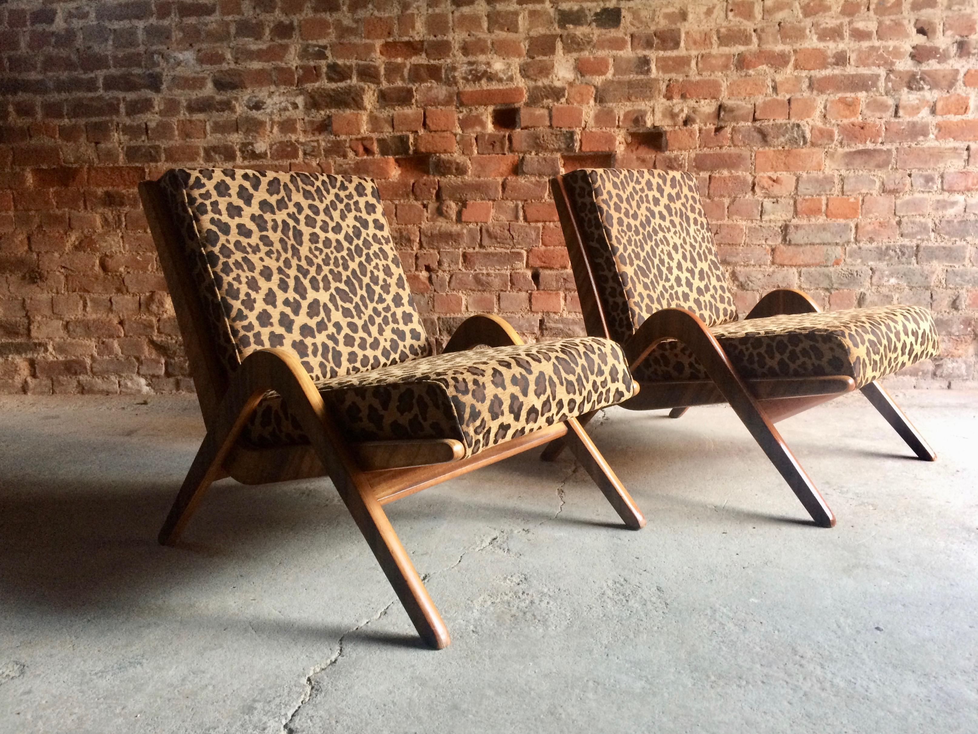Stunning midcentury Neil Morris for Morris of Glasgow pair of Boomerang chairs, circa 1950, the chairs with African walnut veneered ply, having recently restored and reupholstered in a fabulous Leopard print fabric, the chairs are offered in superb