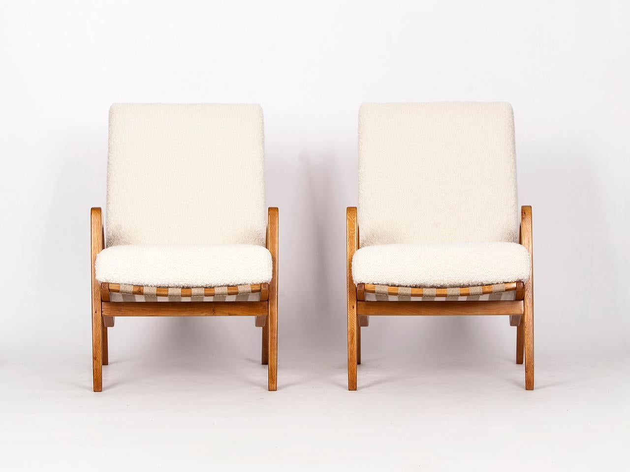 Pair of rare armchairs by Jan Vanek from the 1960s, manufactured in former Czechoslovakia. Newly varnished wooden parts, solid coconut fiber upholstery that complements the hemp straps. Fully restored. With a wonderfully soft english cover boucle