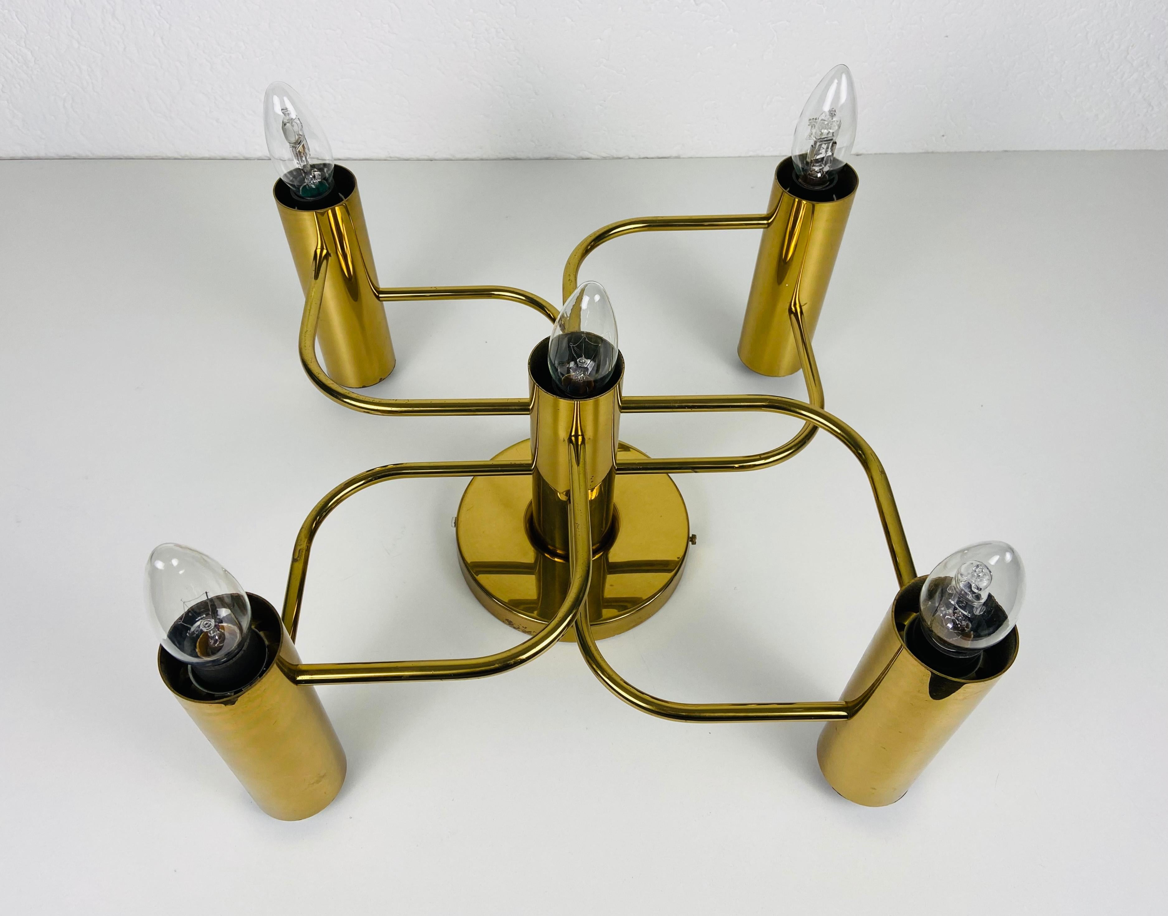 A flush mount made in Germany by Leola in the 1960s. It is fascinating with its five brass arms, each of it with an E14 light bulb.

The light requires five E14 light bulbs. Works with both 120/220V. Very good vintage condition.

Free worldwide