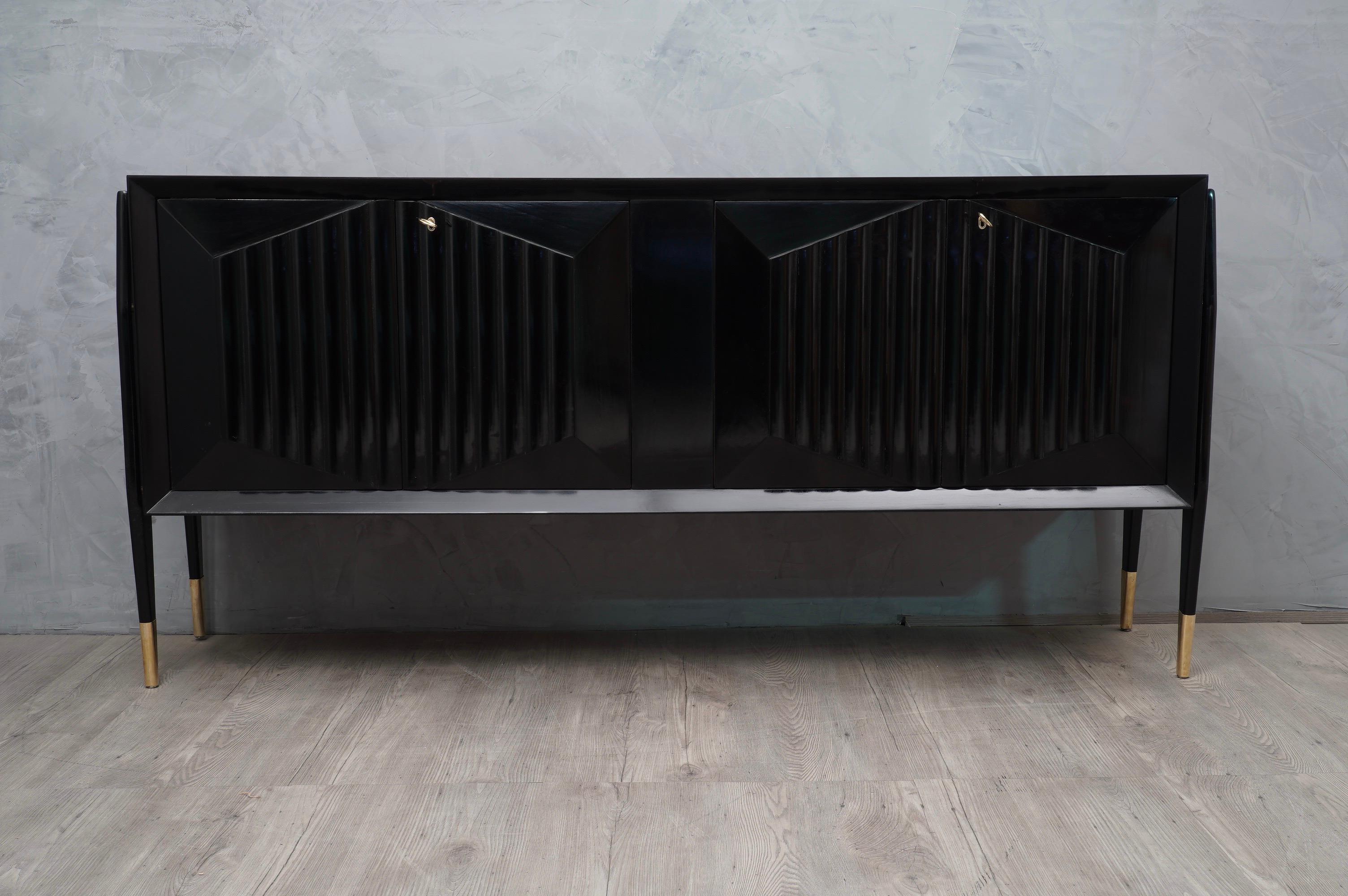 Wonderful Italian sideboards of the midcentury, precious in its processing. This sideboards has a very luxurious appearance, due the use of not common materials and the design.

All polished in black shellac. The structure is in wood, the top is