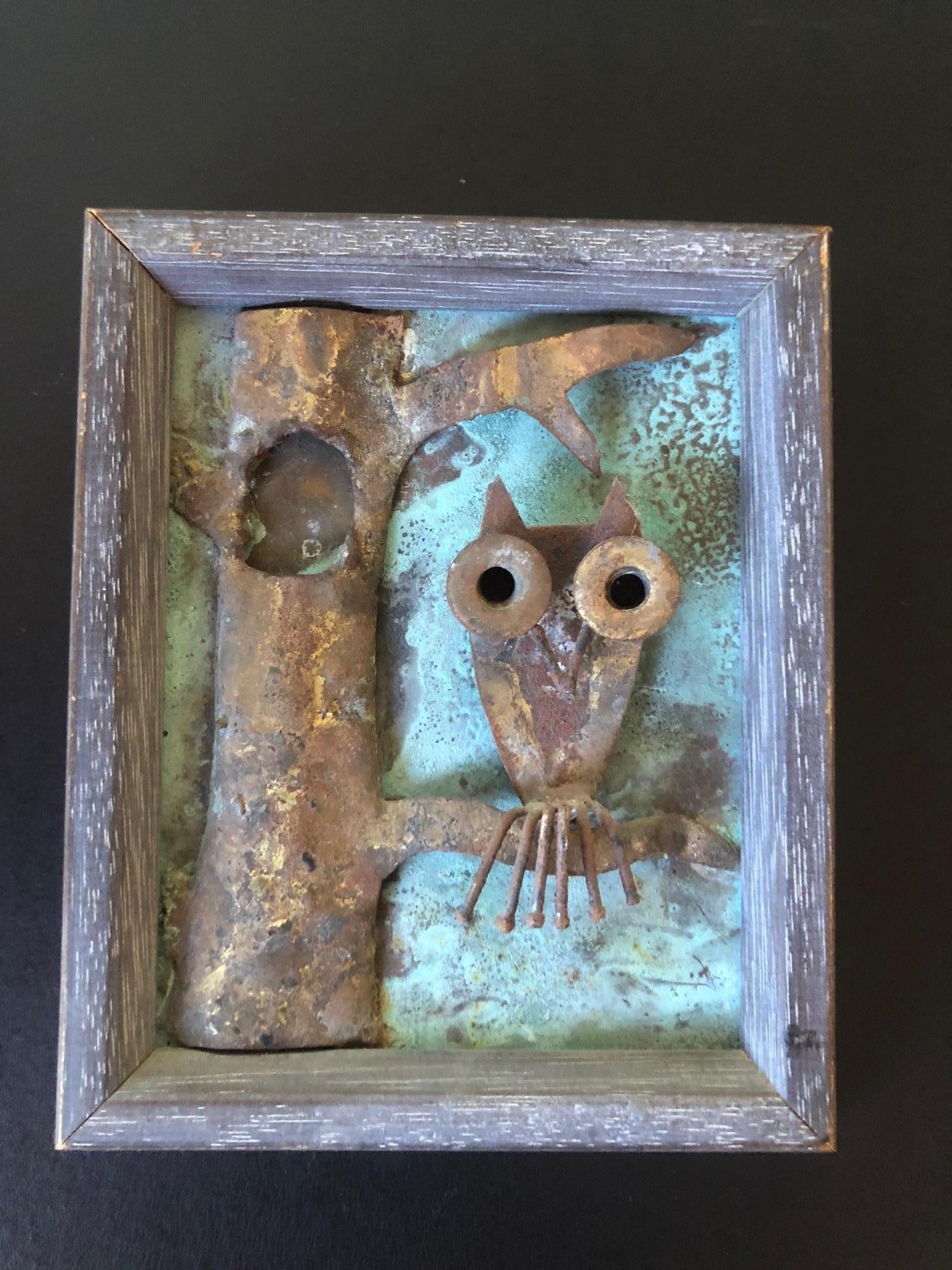 Striking midcentury art piece of an owl in a tree made of brass and bronze in a small frame. The piece is well done and has a great vintage patina.