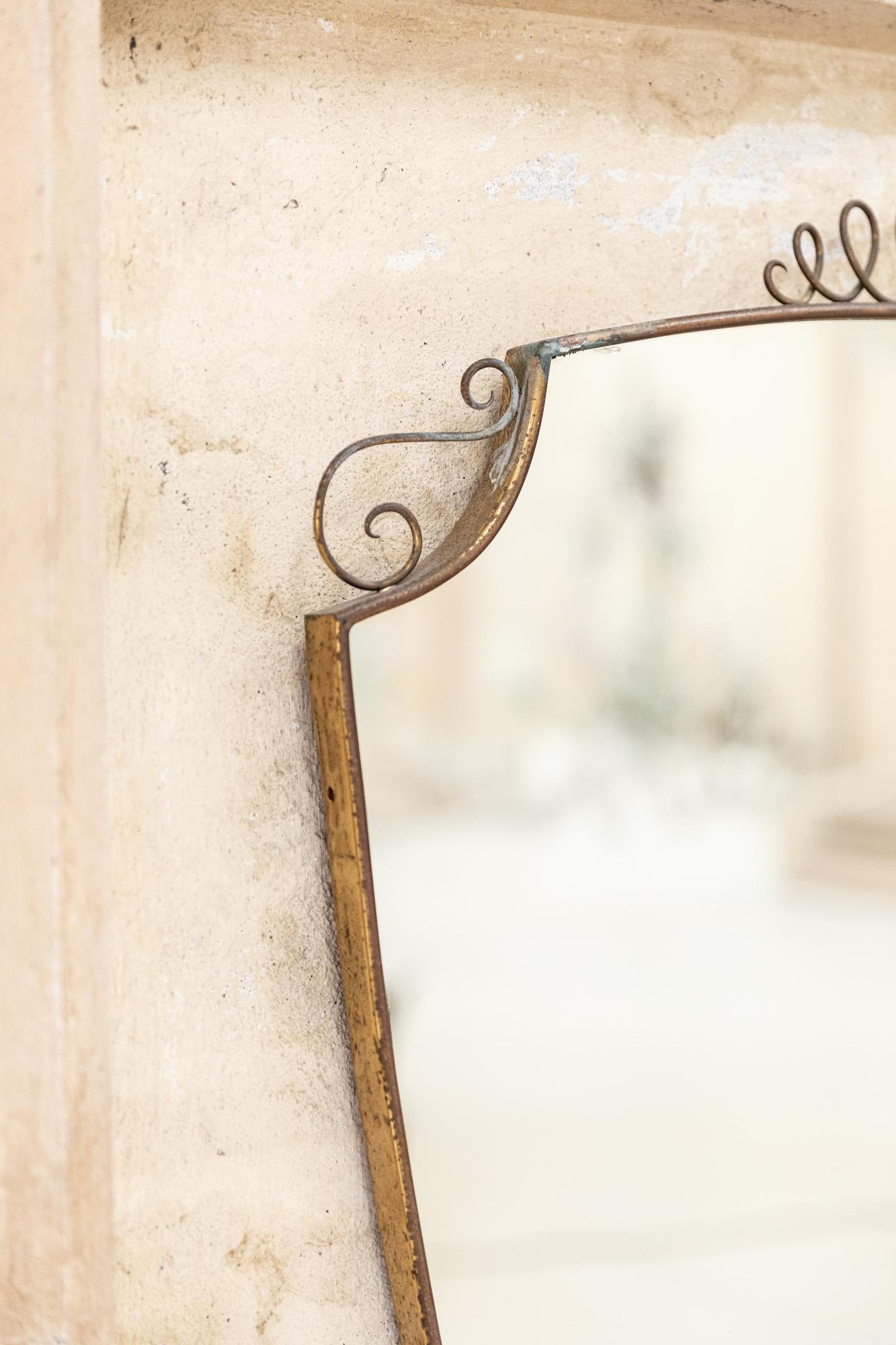 Italian Midcentury brass and glass wall mirror in the style of Gio Ponti, Italy 1950