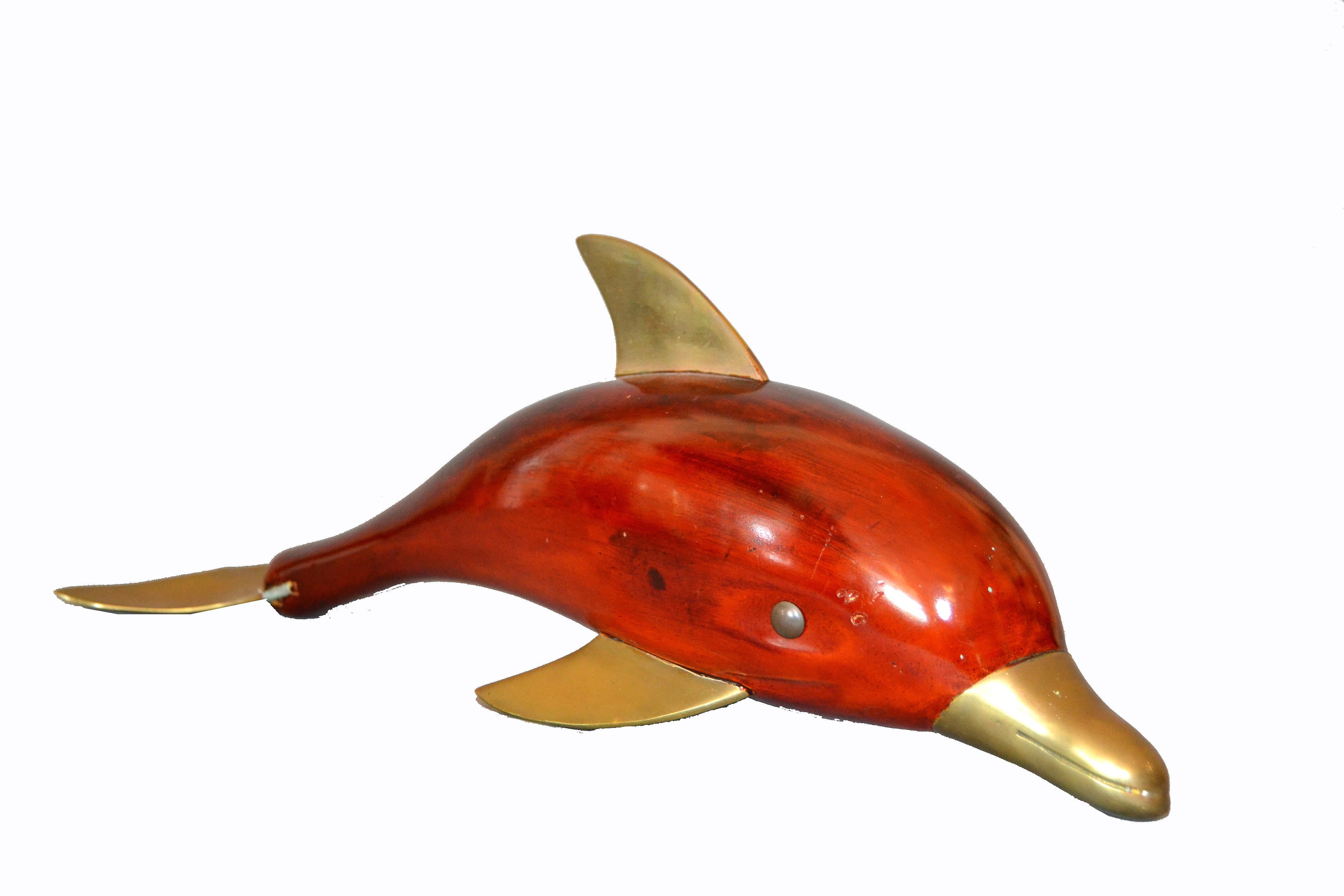 Whimsical Mid-Century Modern brass and rosewood dolphin sculpture.
No Markings.