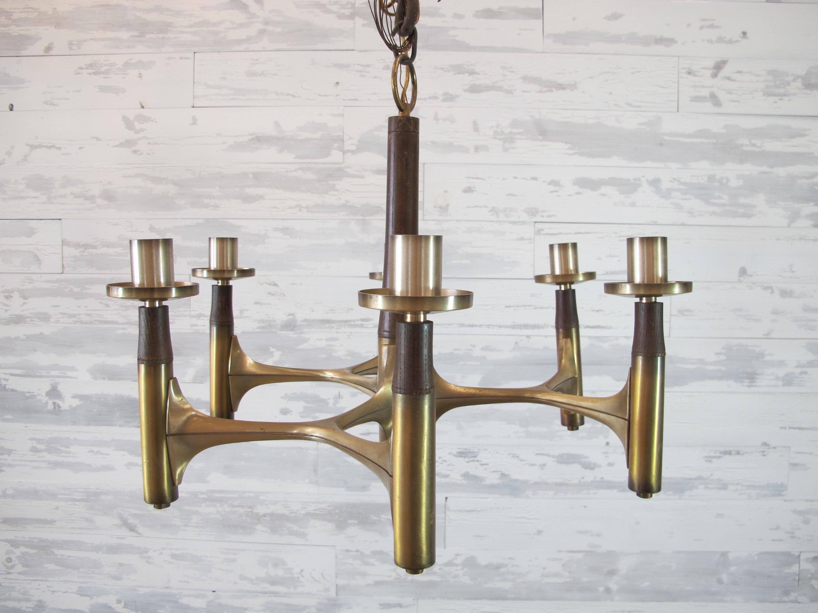 Great Mid-Century Modern brass and wood chandelier. Six lights with standard sockets up to 60 watts. This piece has been newly wired and is UL approved with chain and canopy. Everything else on the chandelier is original. The piece has aging but is