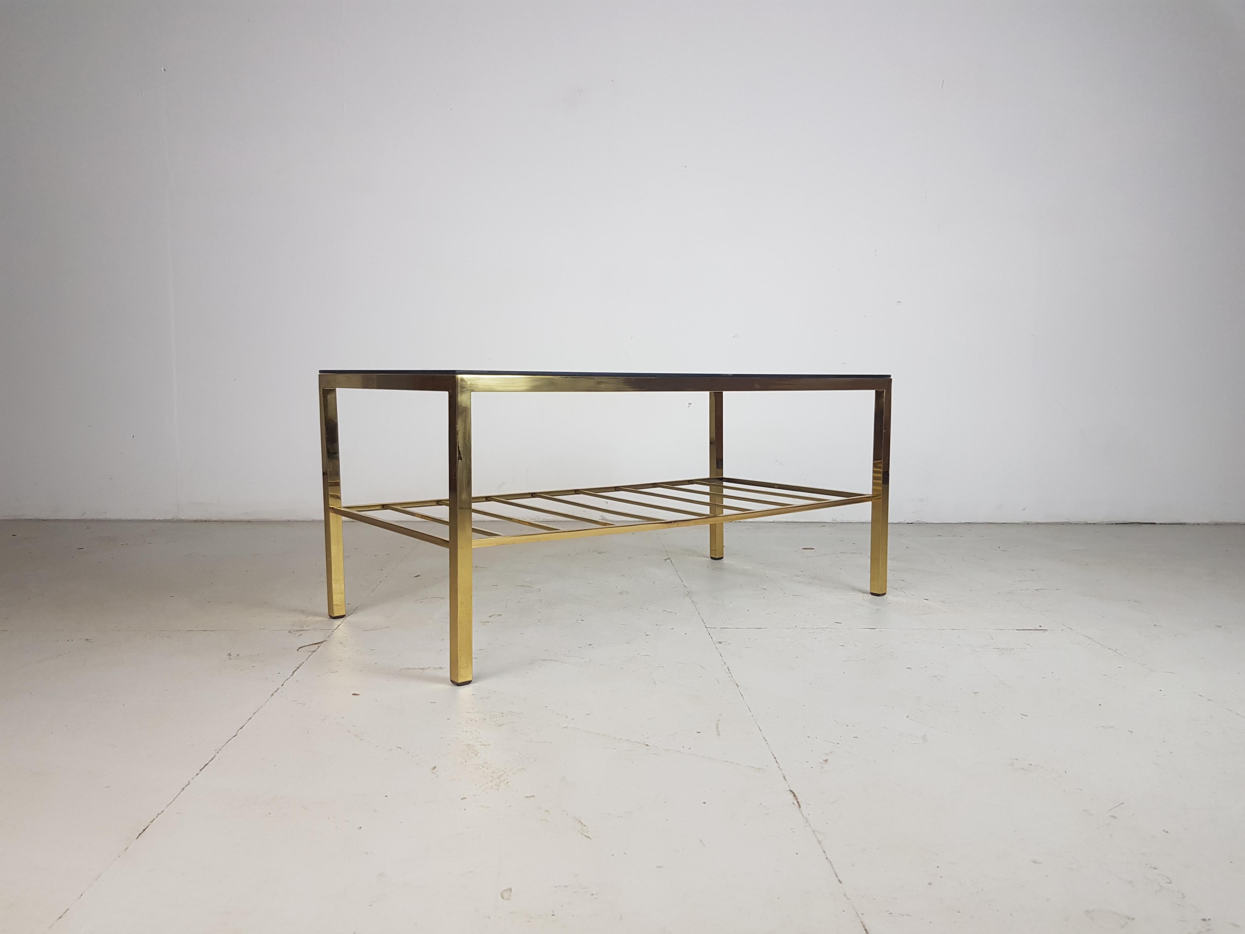 Lovely vintage brass and glass coffee table.

In good vintage condition.  

Approximate dimensions:

Width 92cm

Depth 46cm

Height 42cm.