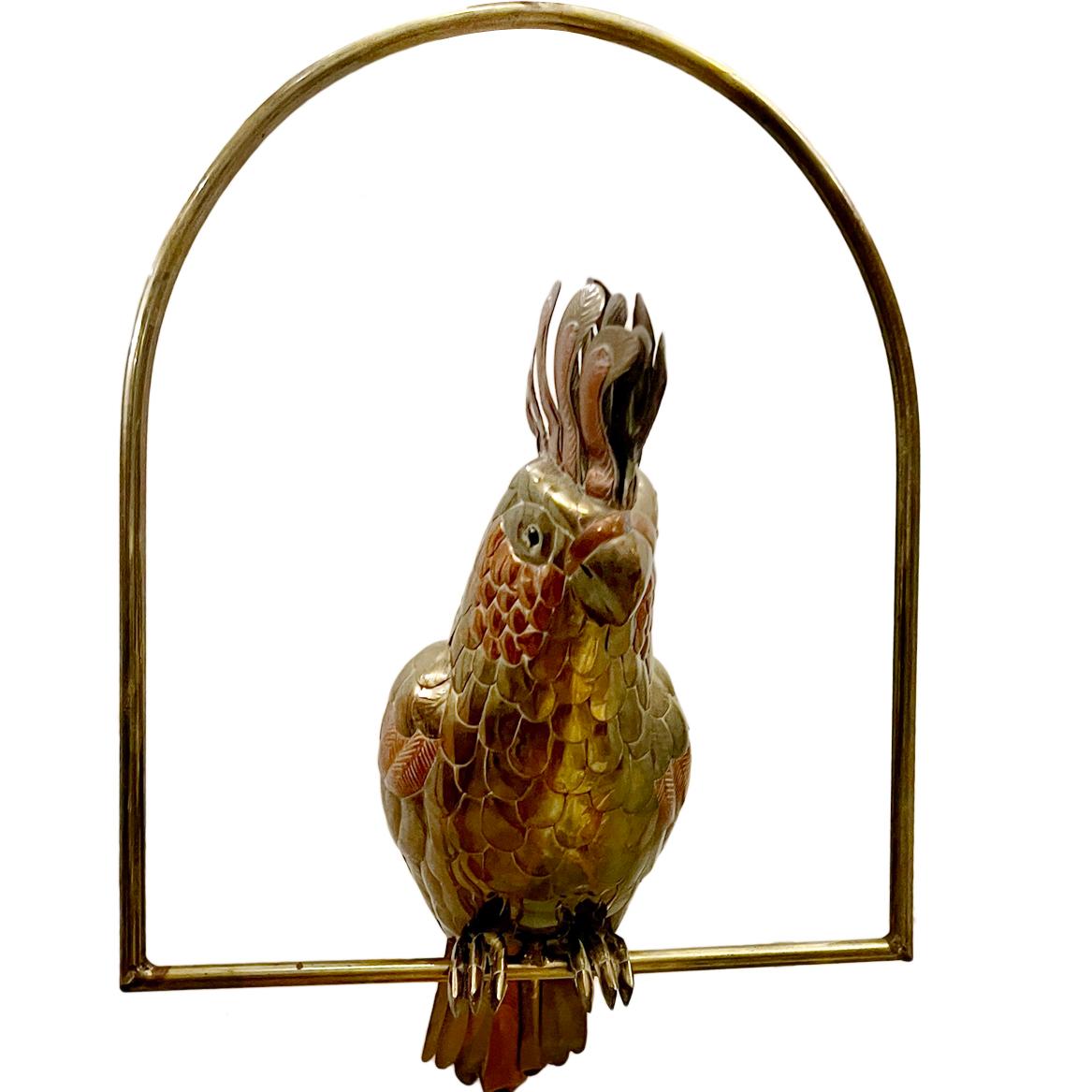 A circa 1960's repoussé brass bird on stand.

Measurements:
Height: 20